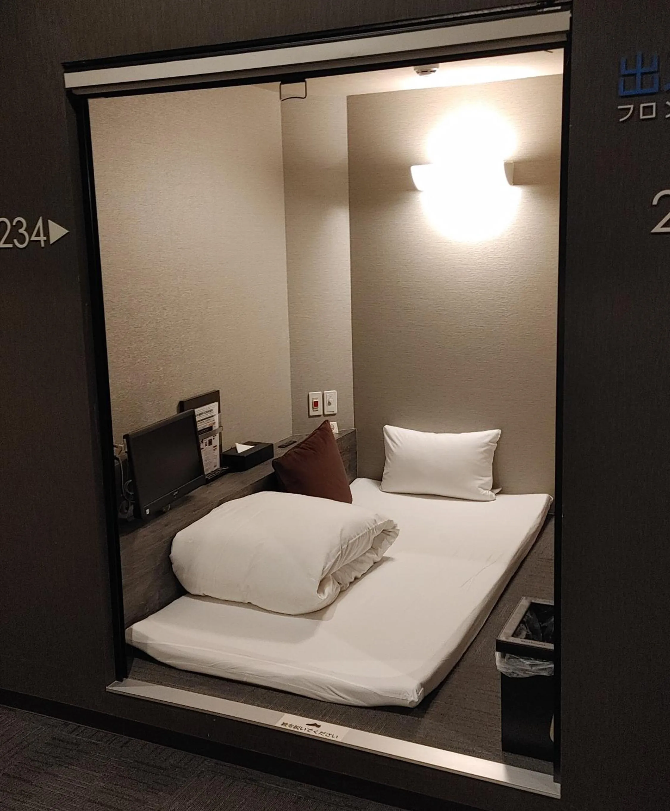 Bed in BIZCOURT CABIN SUSUKINO (Male Only)