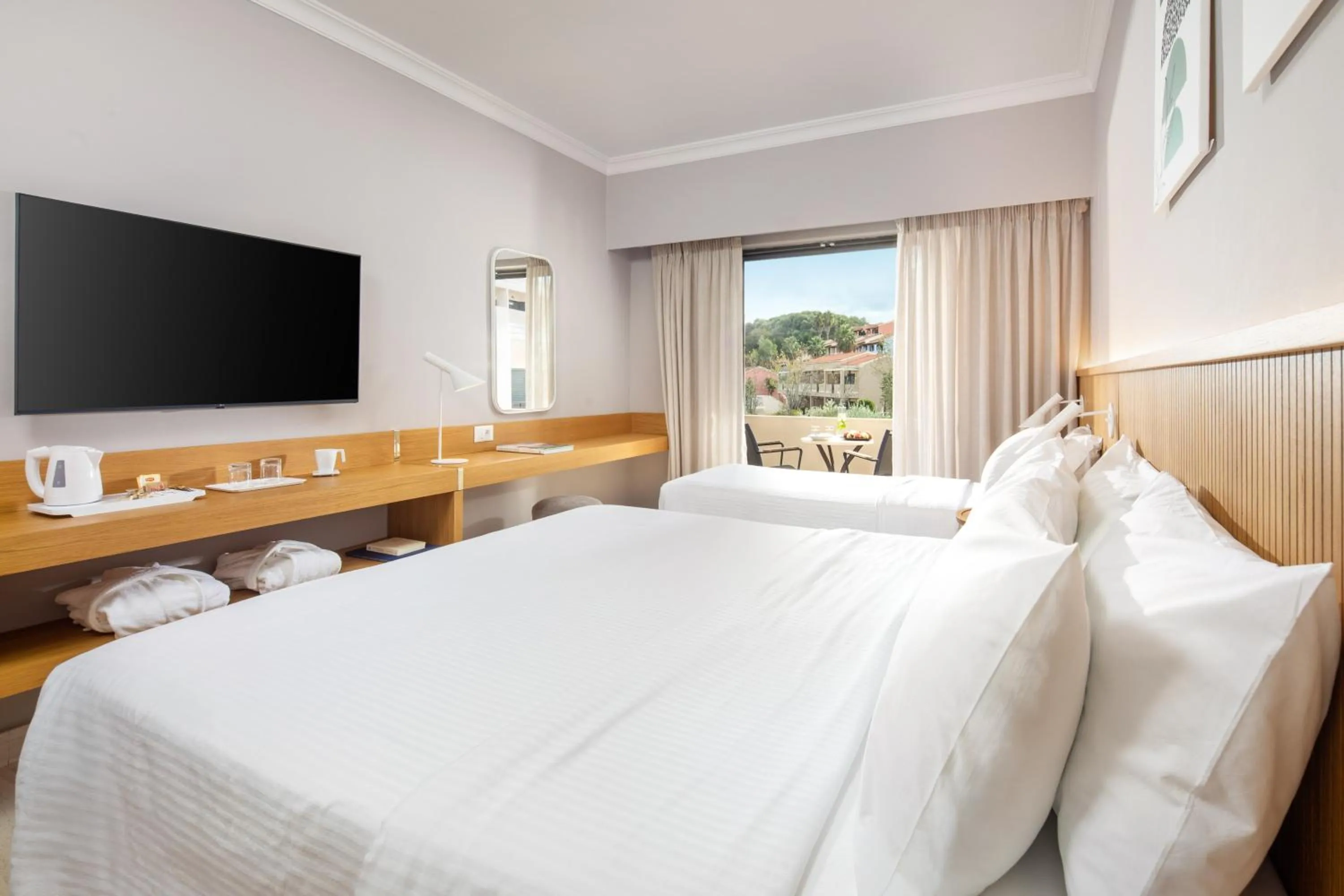 Bed in Roda Beach Resort & Spa