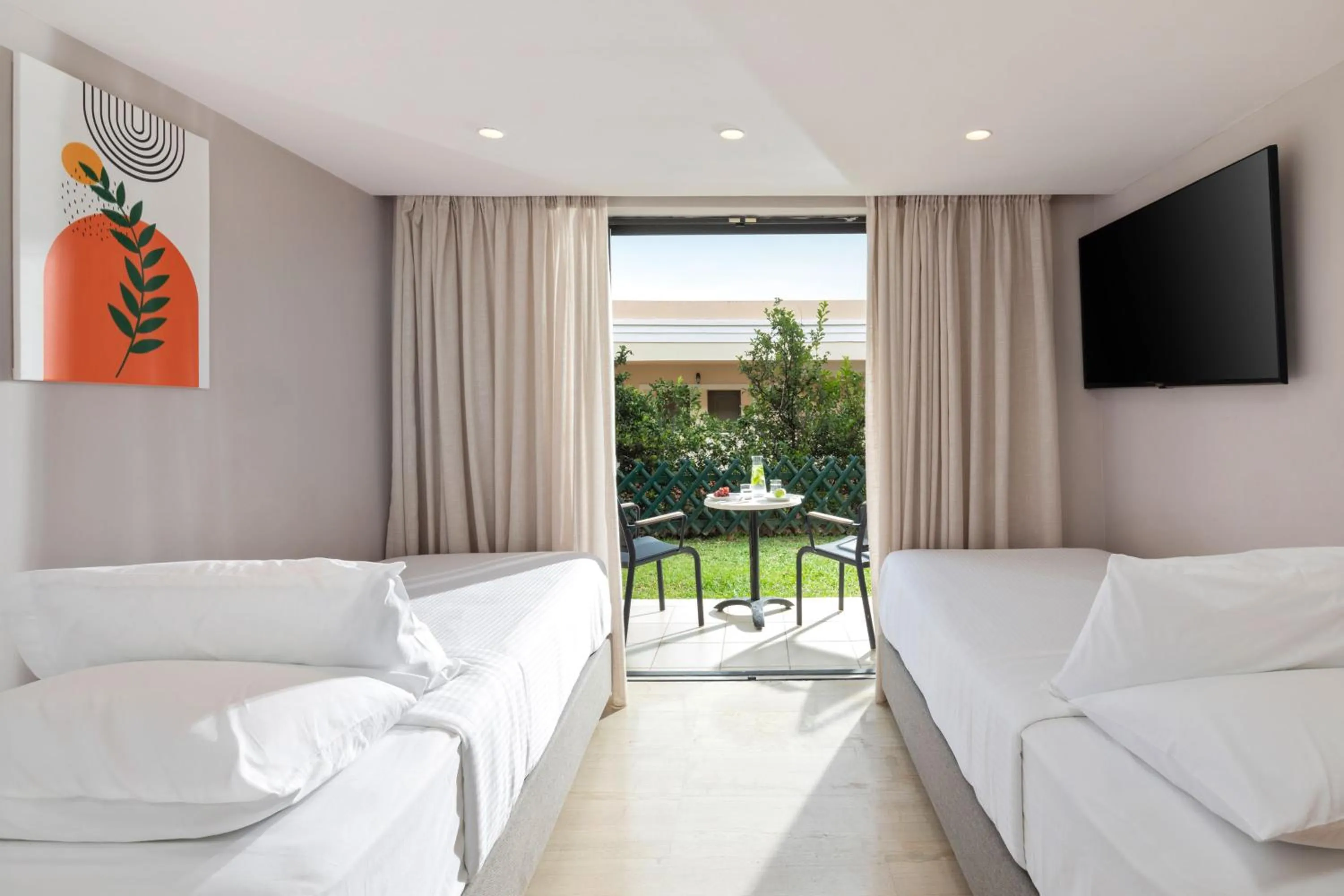 Bed in Roda Beach Resort & Spa