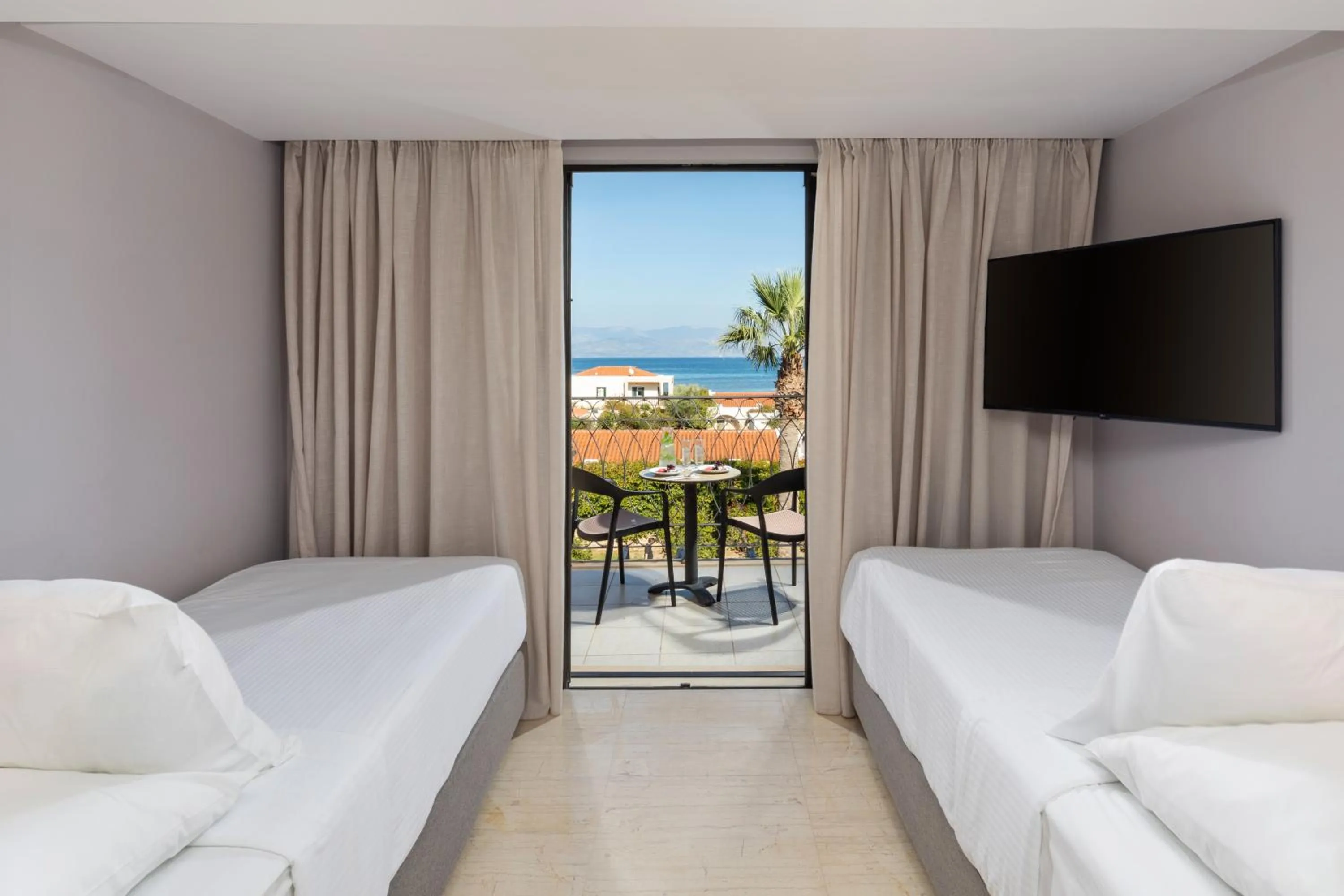 Bed in Roda Beach Resort & Spa