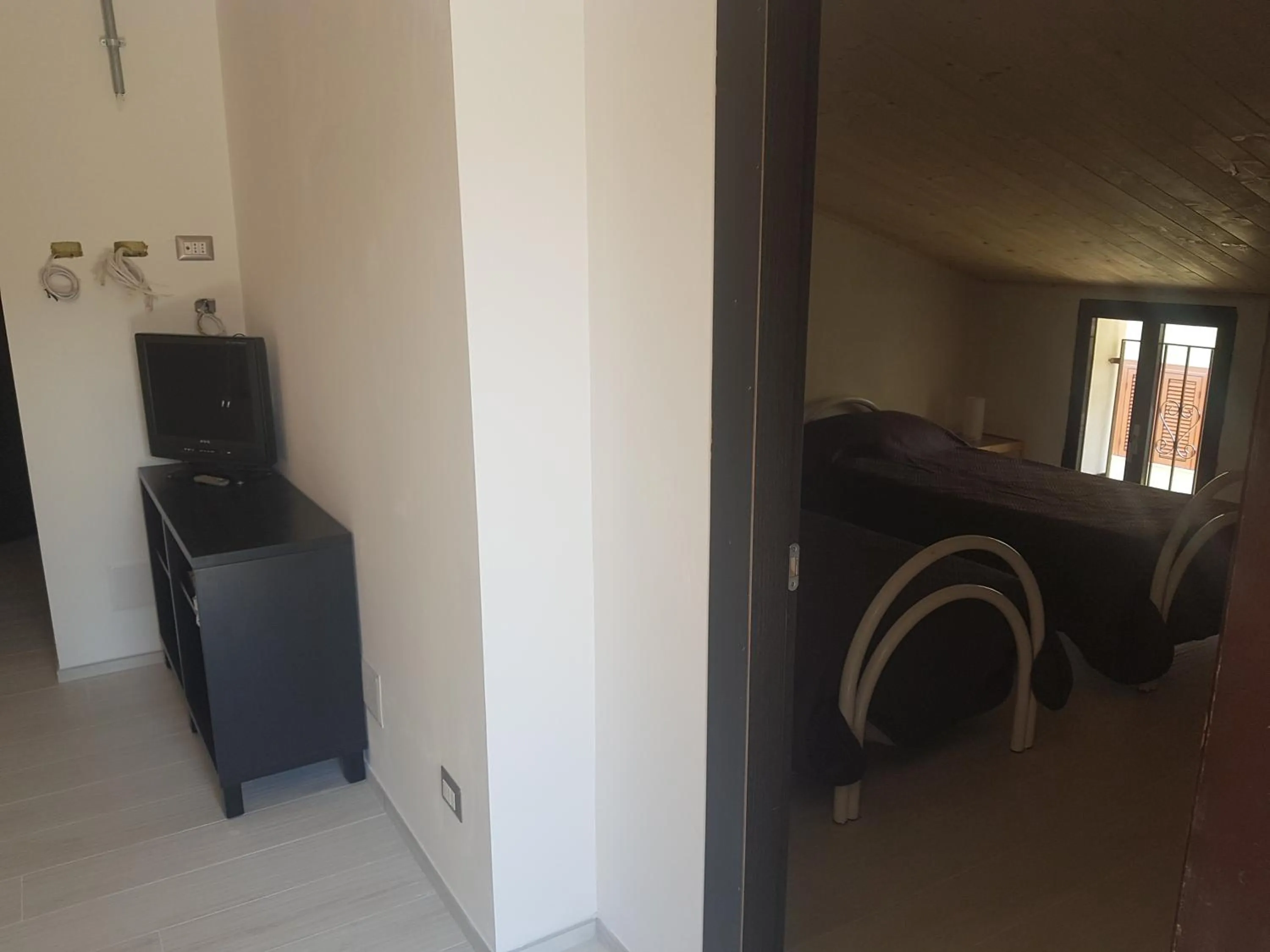 Communal lounge/ TV room in La Casetta di Vitty