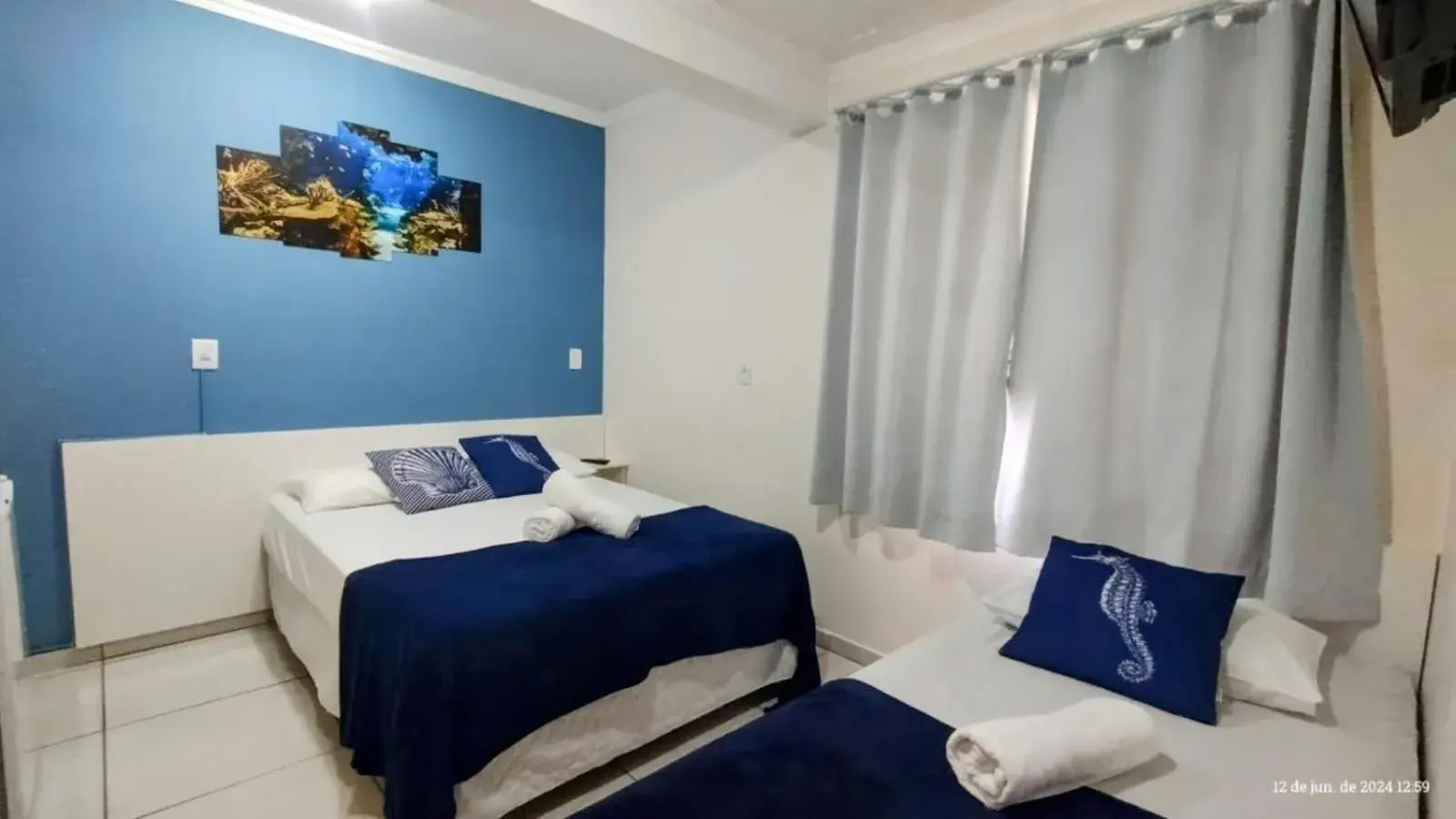 Budget Triple Room in Pousada Baía dos Corais Budget Triple Room in Pousada Baía dos Corais