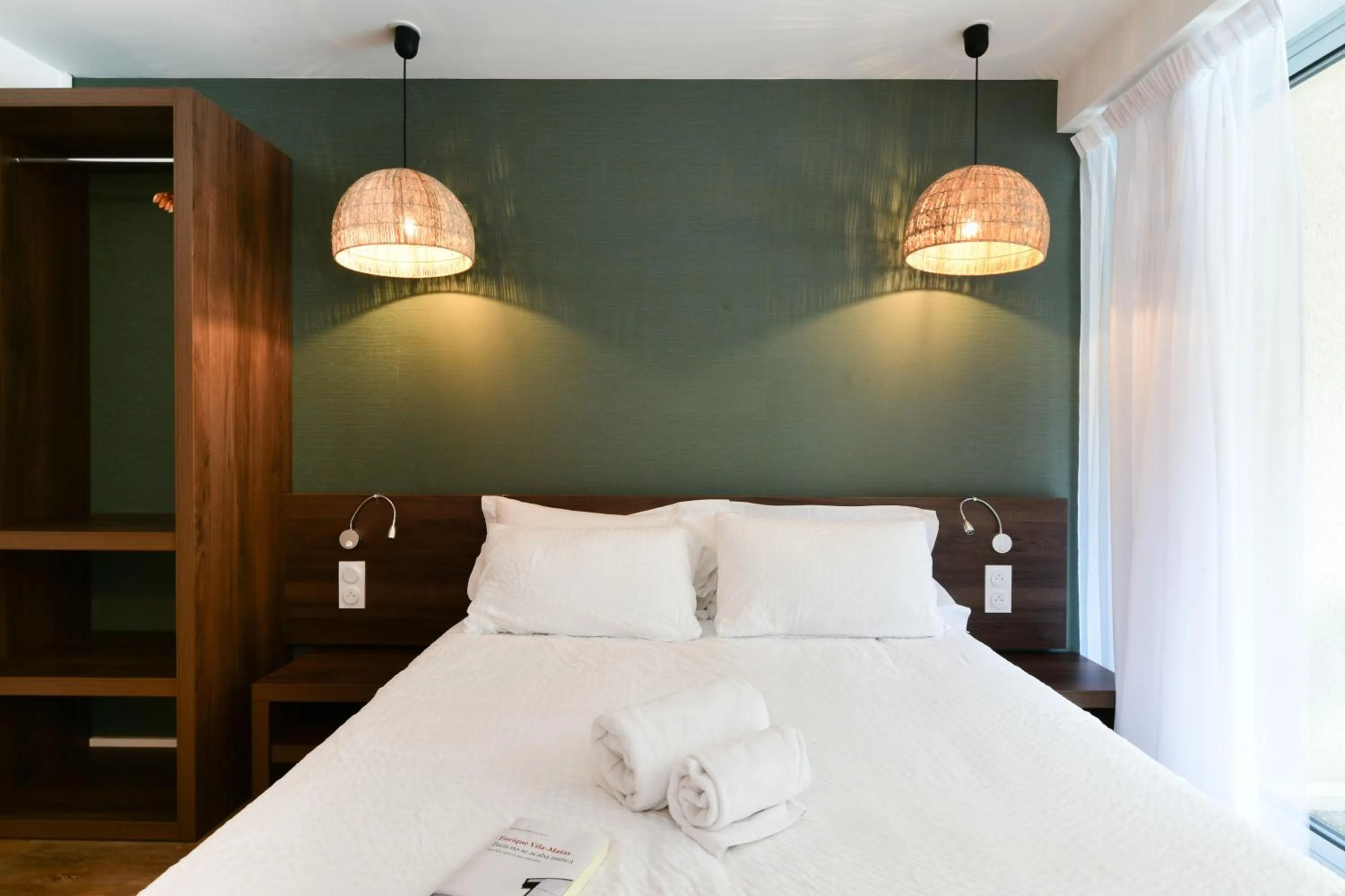 Bed in Hotel Logis Lacotel