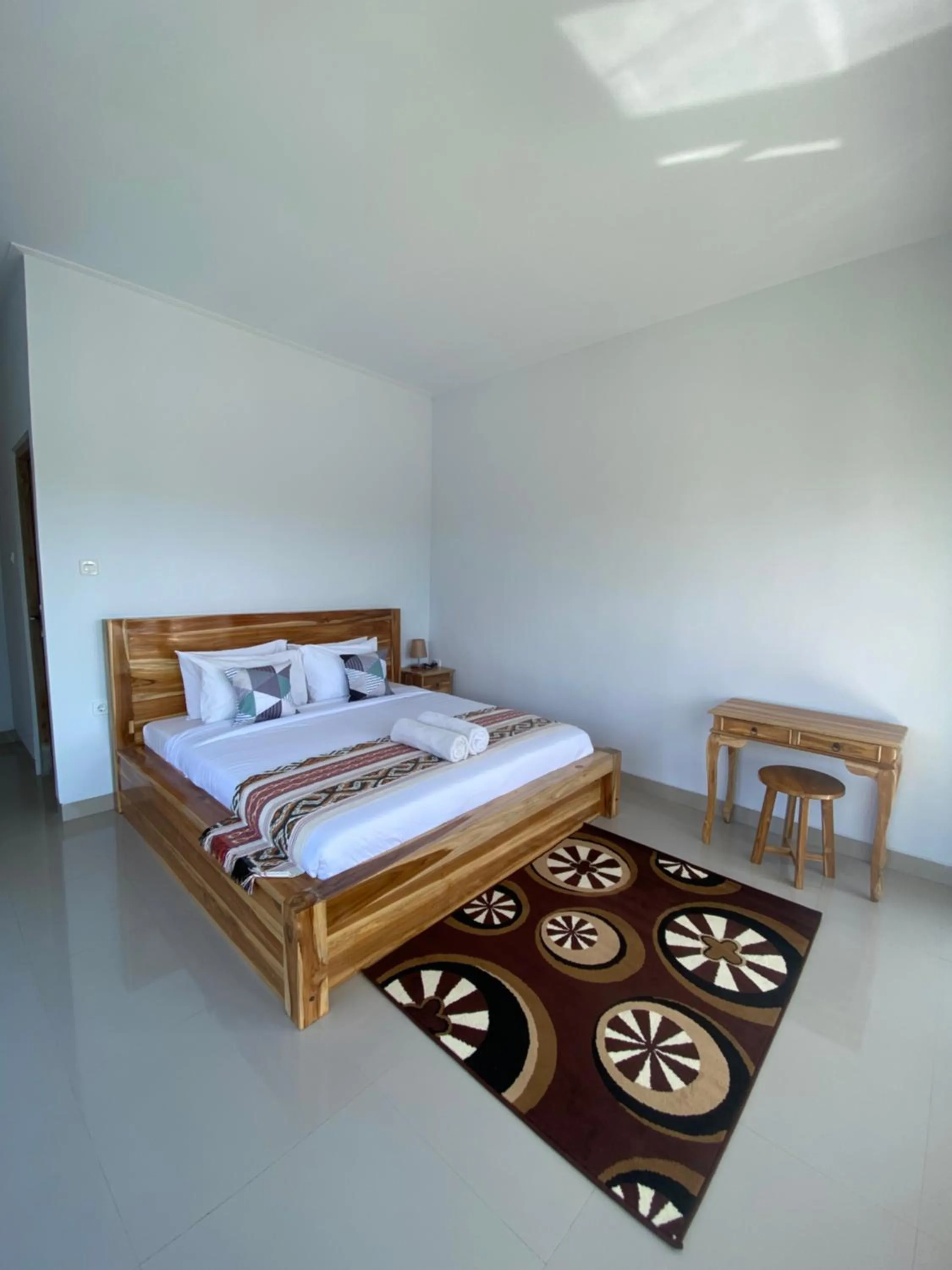 Bed in Batur Pyramid Guesthouse