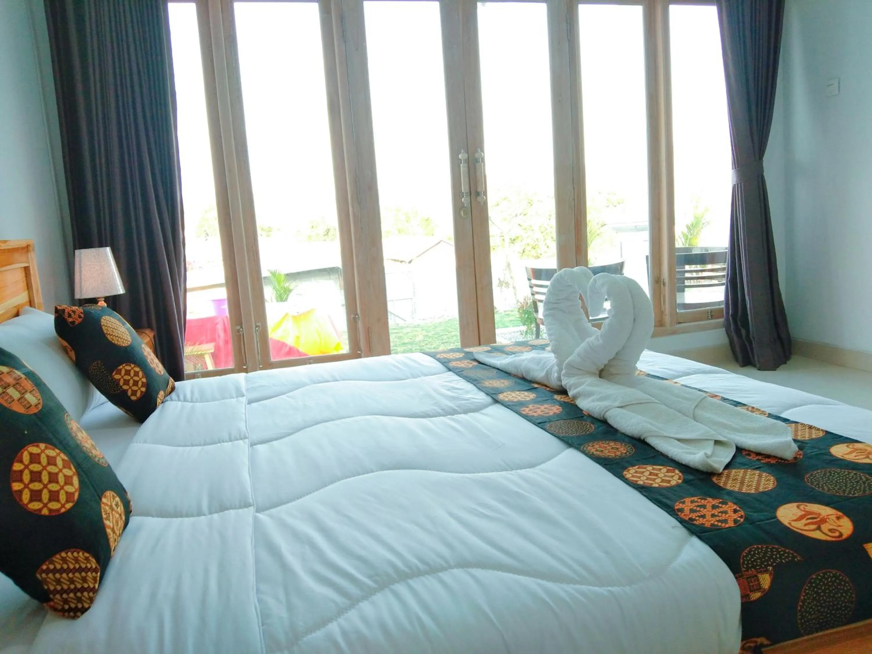 Bed in Batur Pyramid Guesthouse