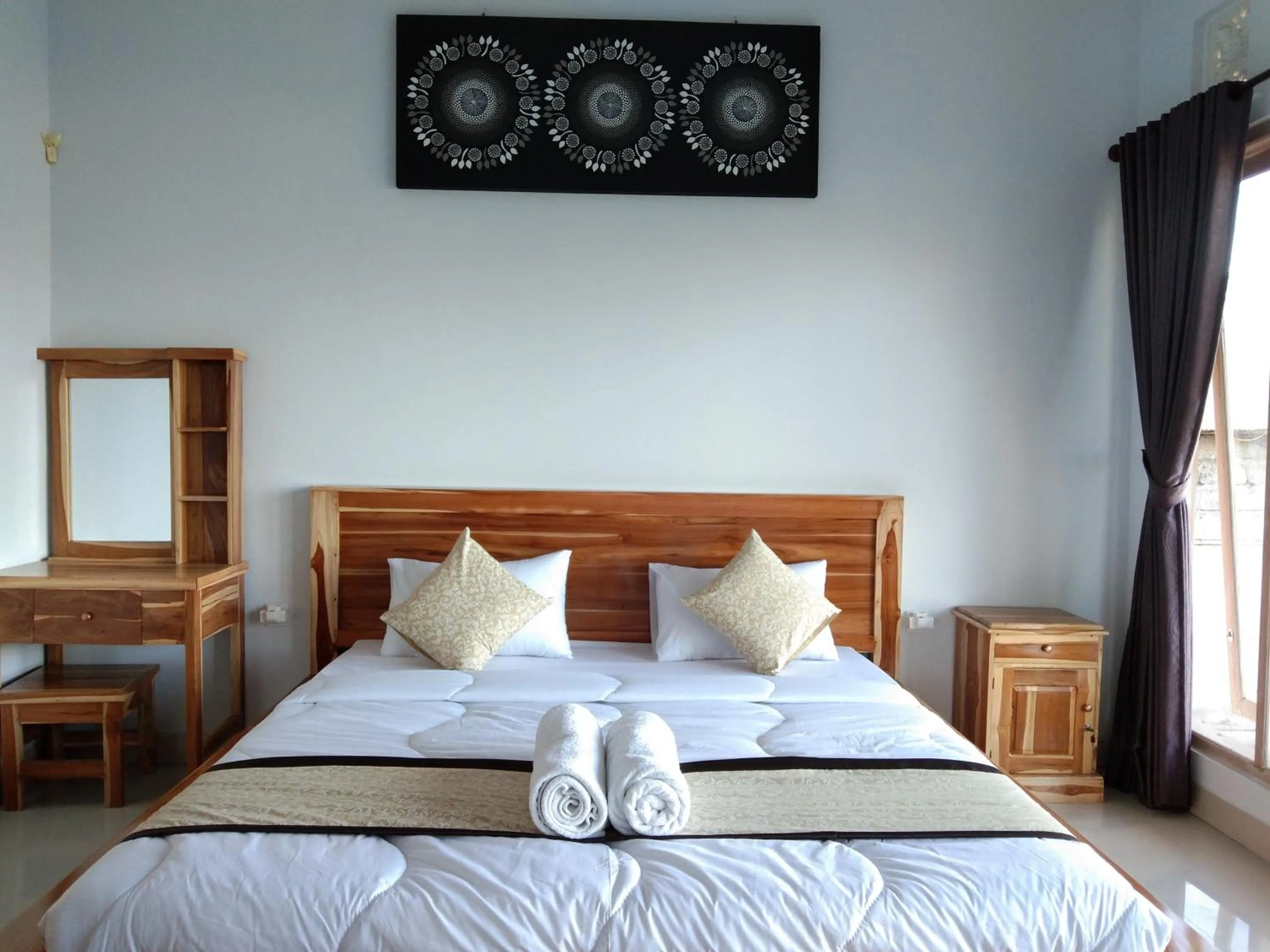 Bed in Batur Pyramid Guesthouse