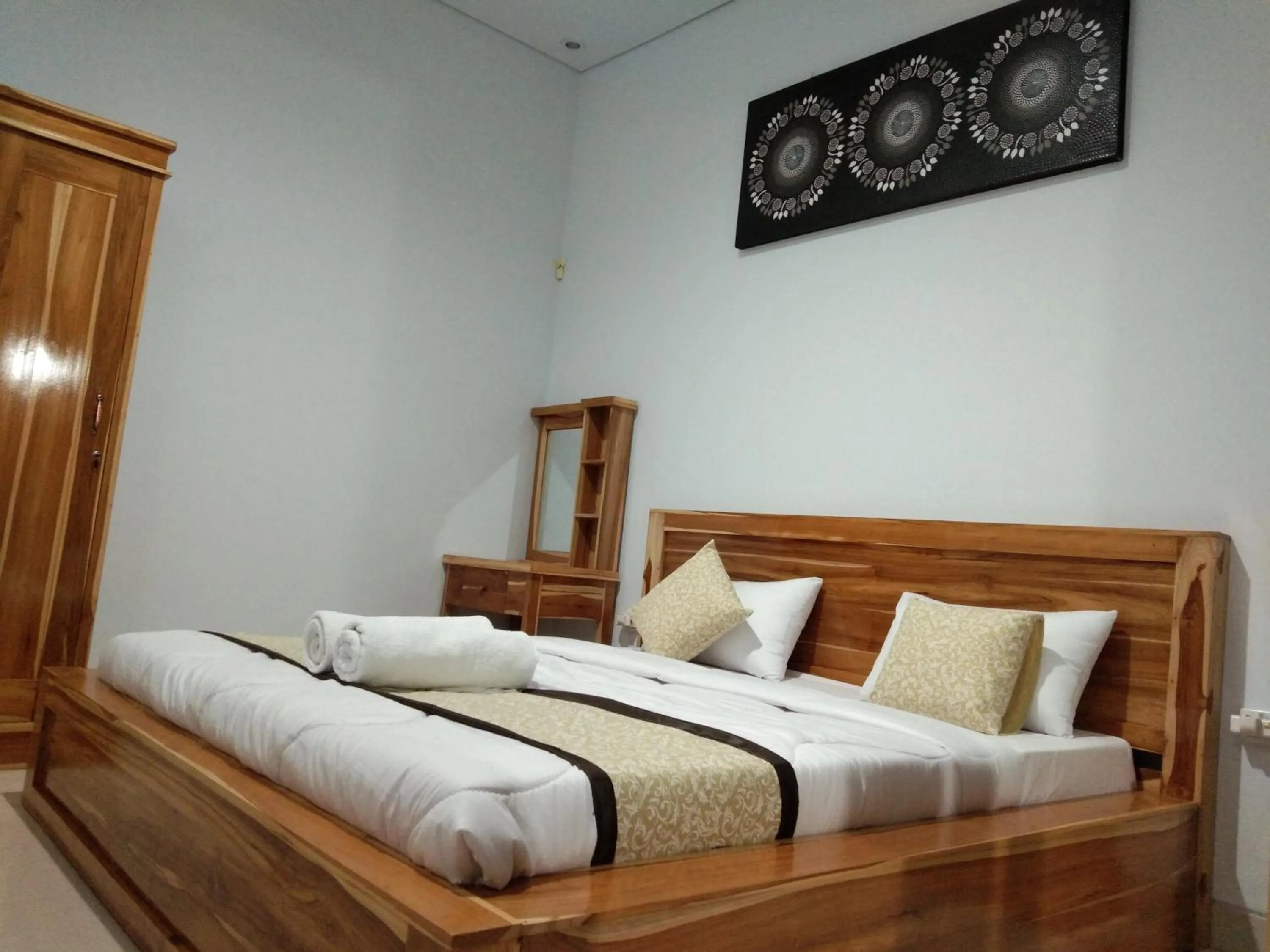 Bed in Batur Pyramid Guesthouse