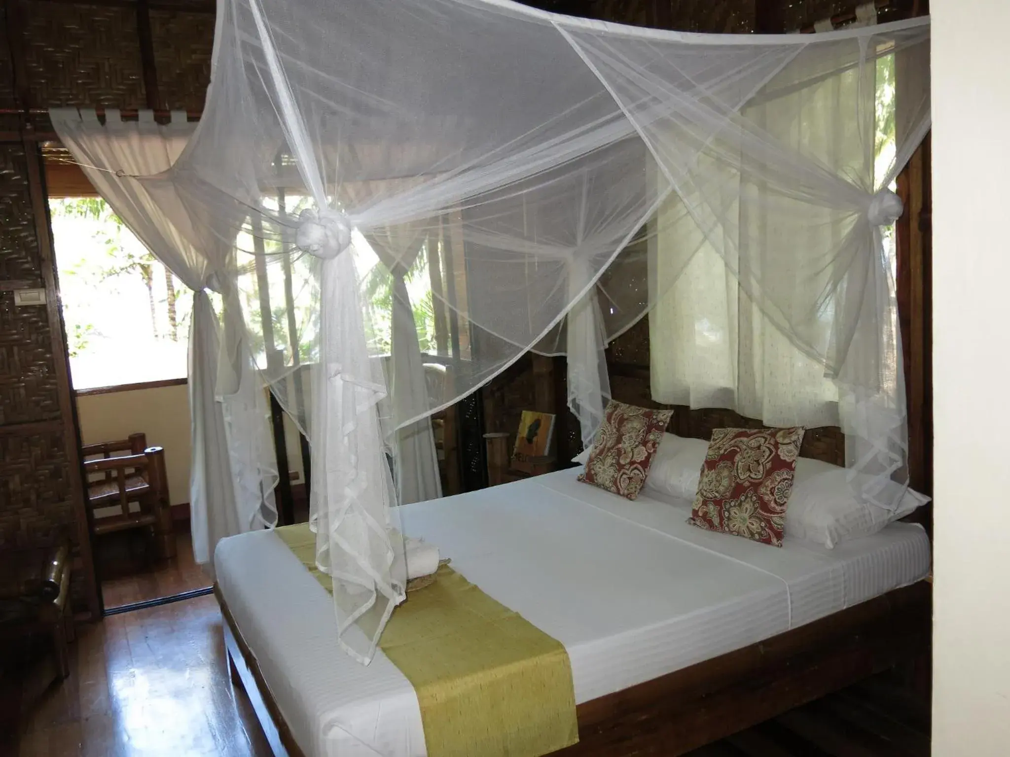 Bed in Camiguin Volcan Beach Eco Retreat & Dive Resort Bed in Camiguin Volcan Beach Eco Retreat & Dive Resort