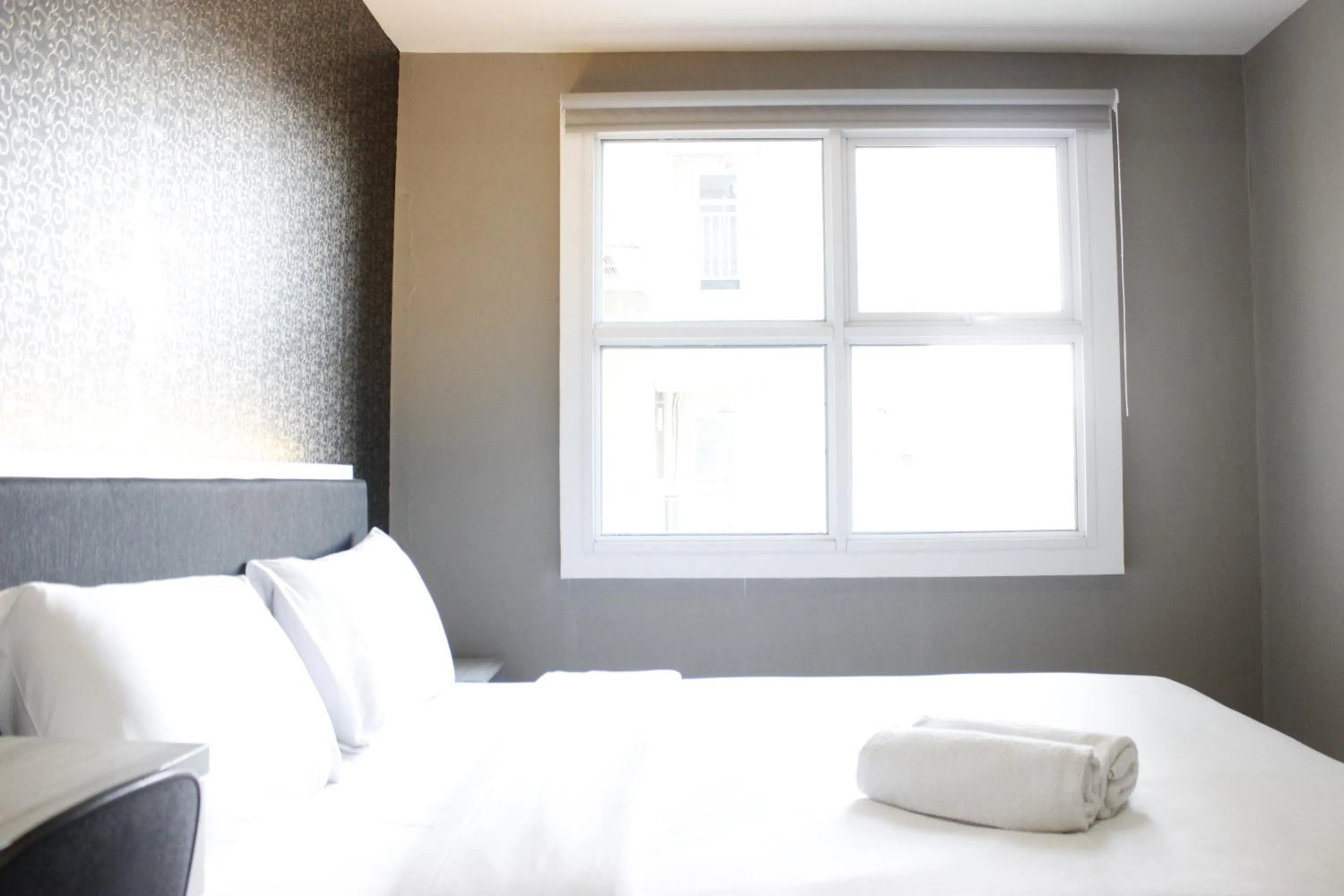 Bed in Quiet 2BR Apartment @ Parahyangan Residence Apartement with Mountain View By Travelio