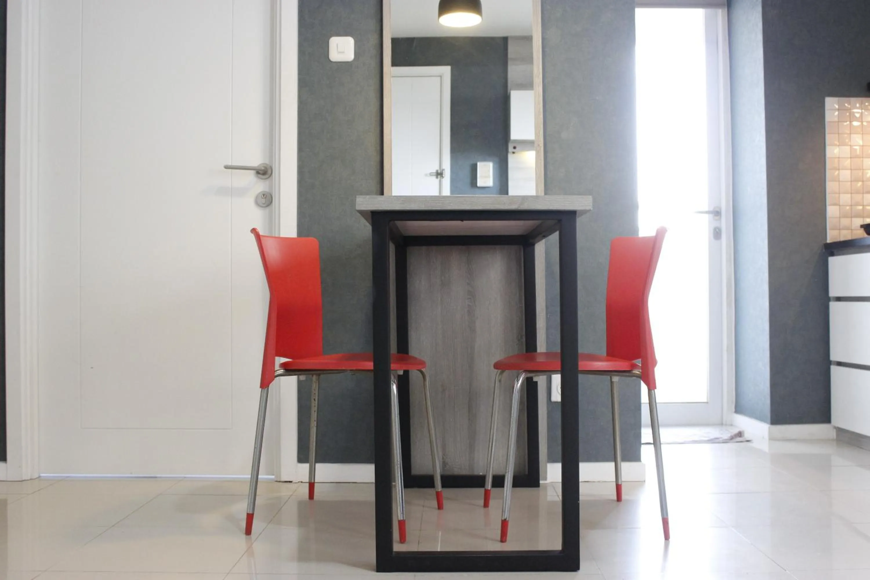 Dining area in Quiet 2BR Apartment @ Parahyangan Residence Apartement with Mountain View By Travelio