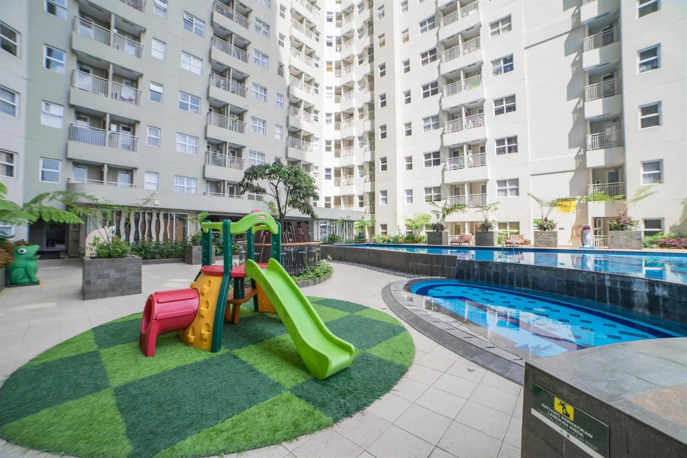 Property building in Quiet 2BR Apartment @ Parahyangan Residence Apartement with Mountain View By Travelio