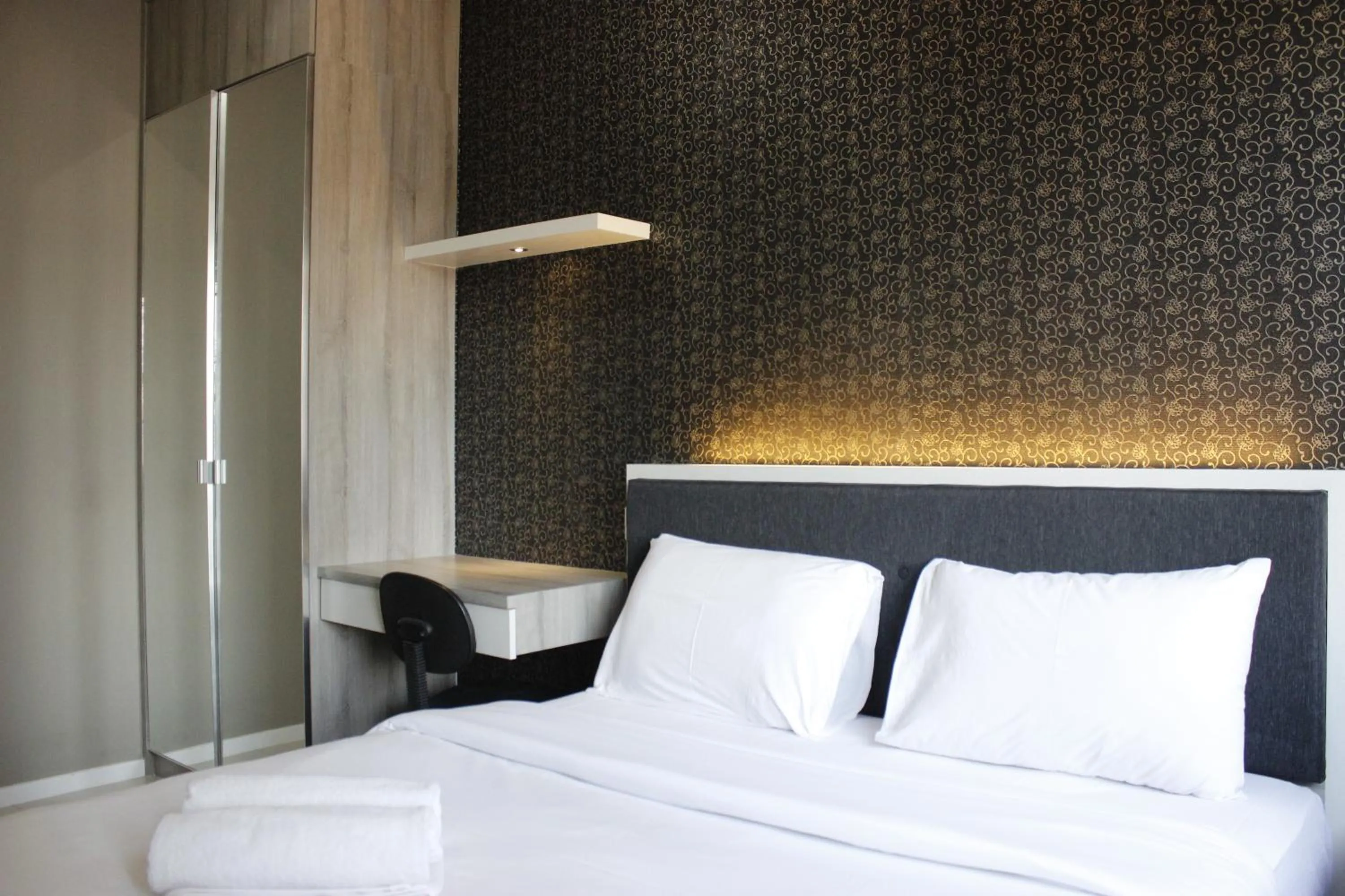 Bed in Quiet 2BR Apartment @ Parahyangan Residence Apartement with Mountain View By Travelio