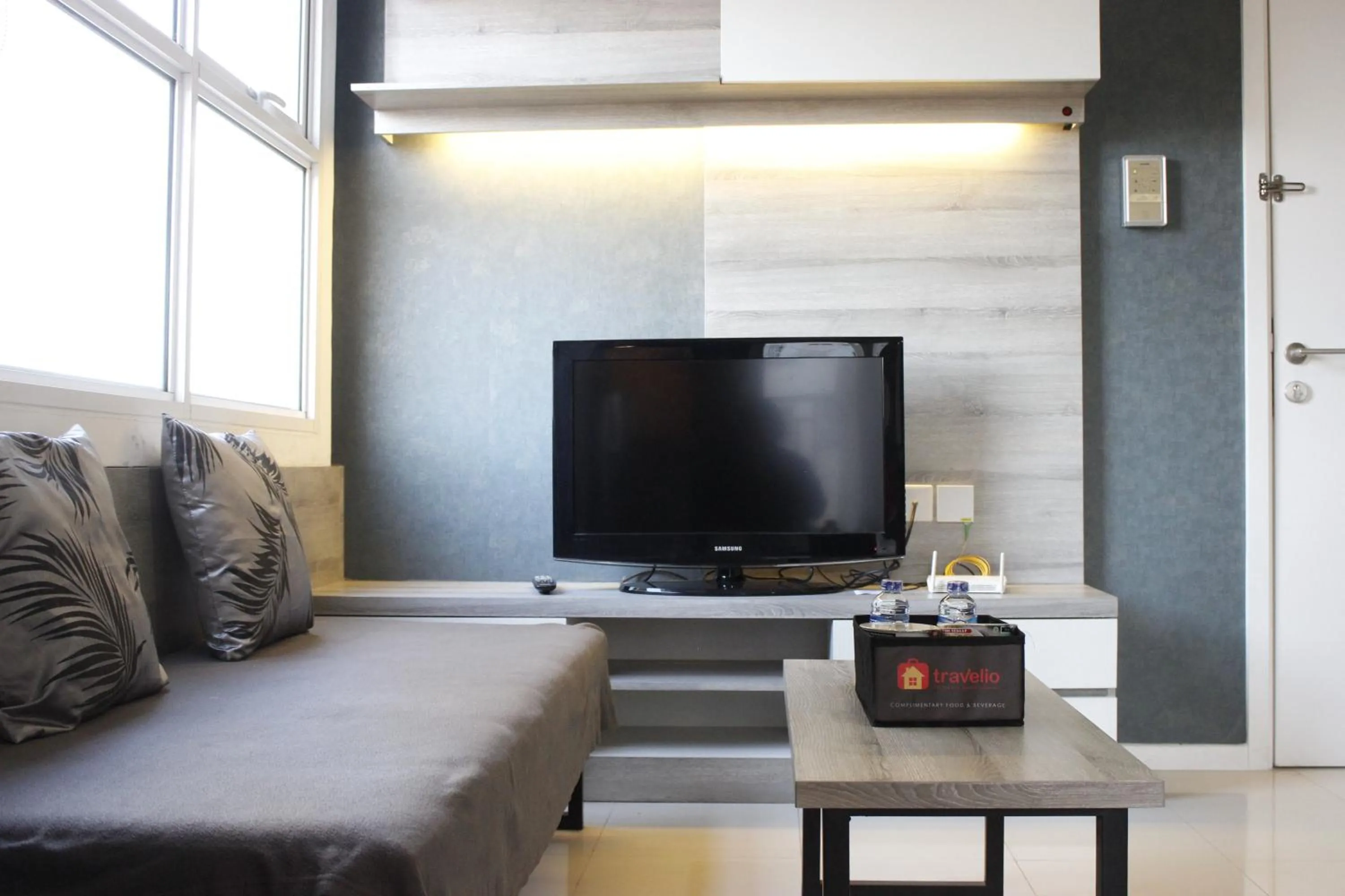 Living room in Quiet 2BR Apartment @ Parahyangan Residence Apartement with Mountain View By Travelio