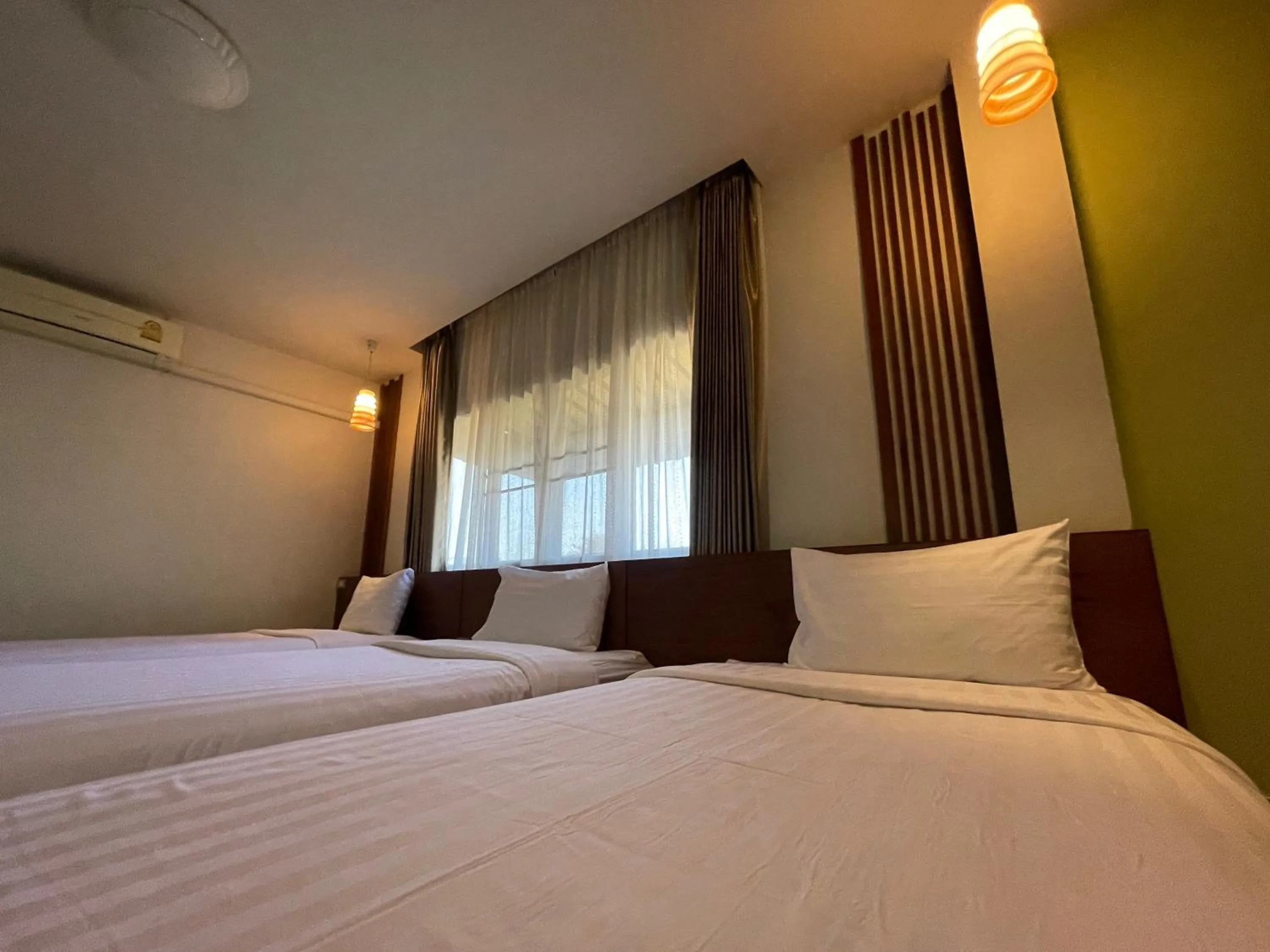 Bed in Chedi Chiangrai Boutique Hotel
