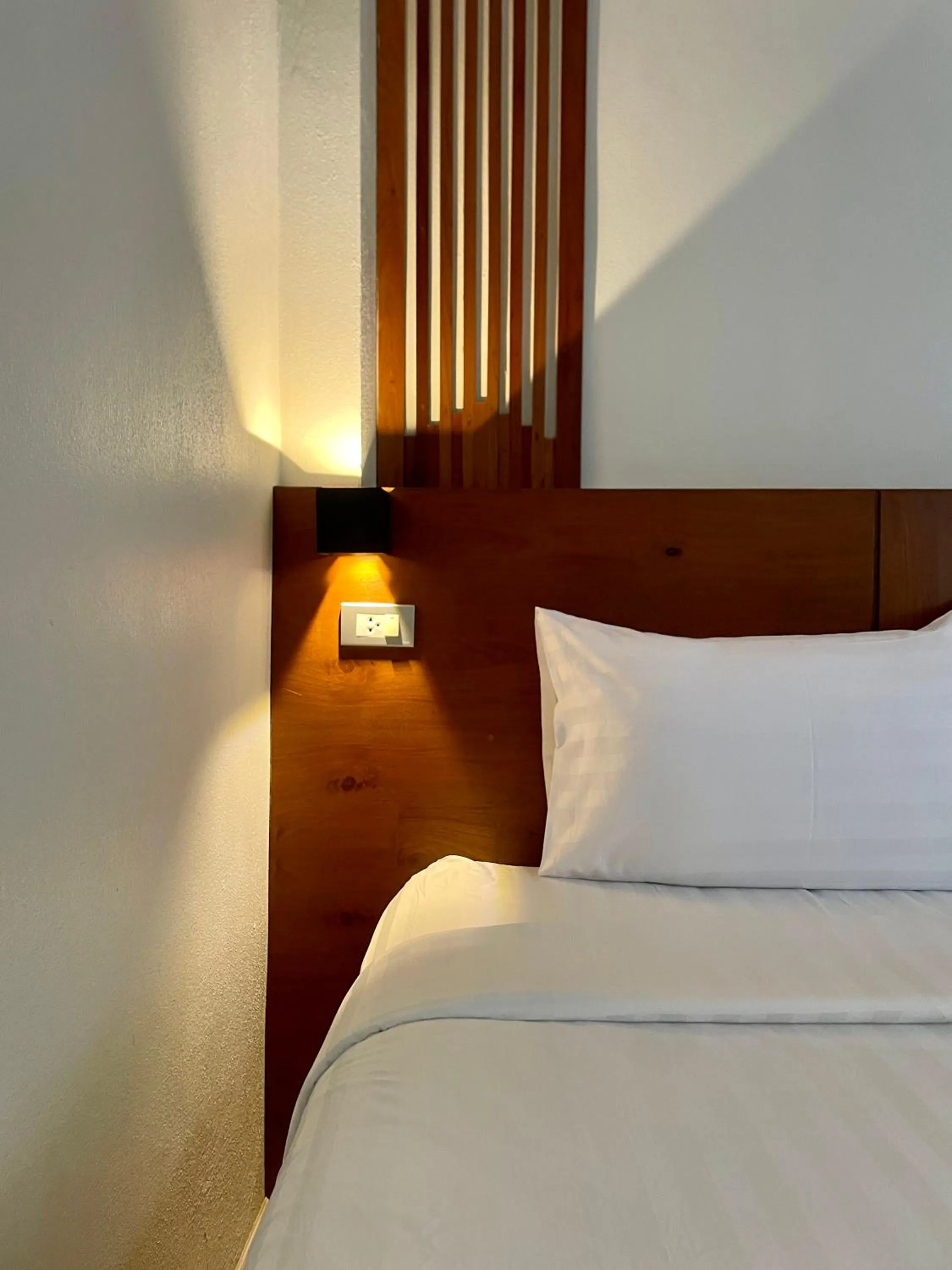 Bed in Chedi Chiangrai Boutique Hotel