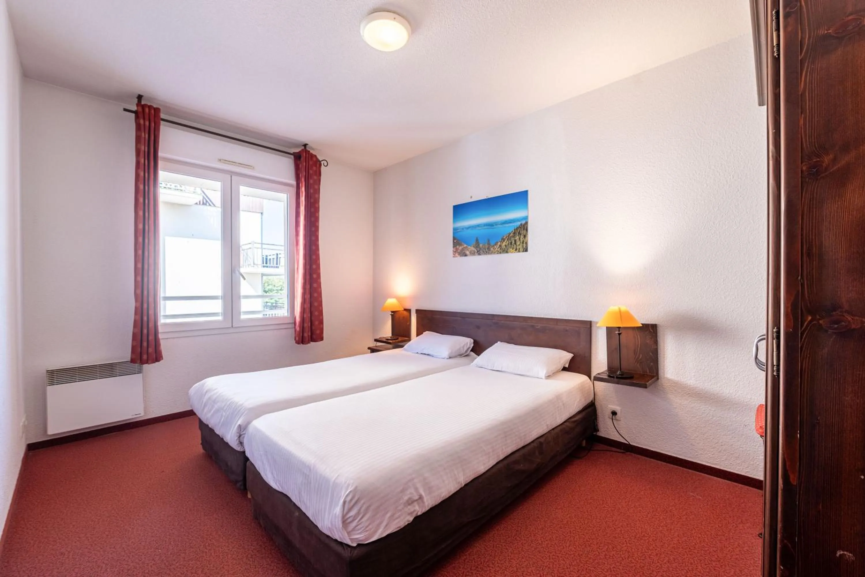 Bed in Zenitude Evian Les Terrasses du Lac, an Ascend Collection Hotel