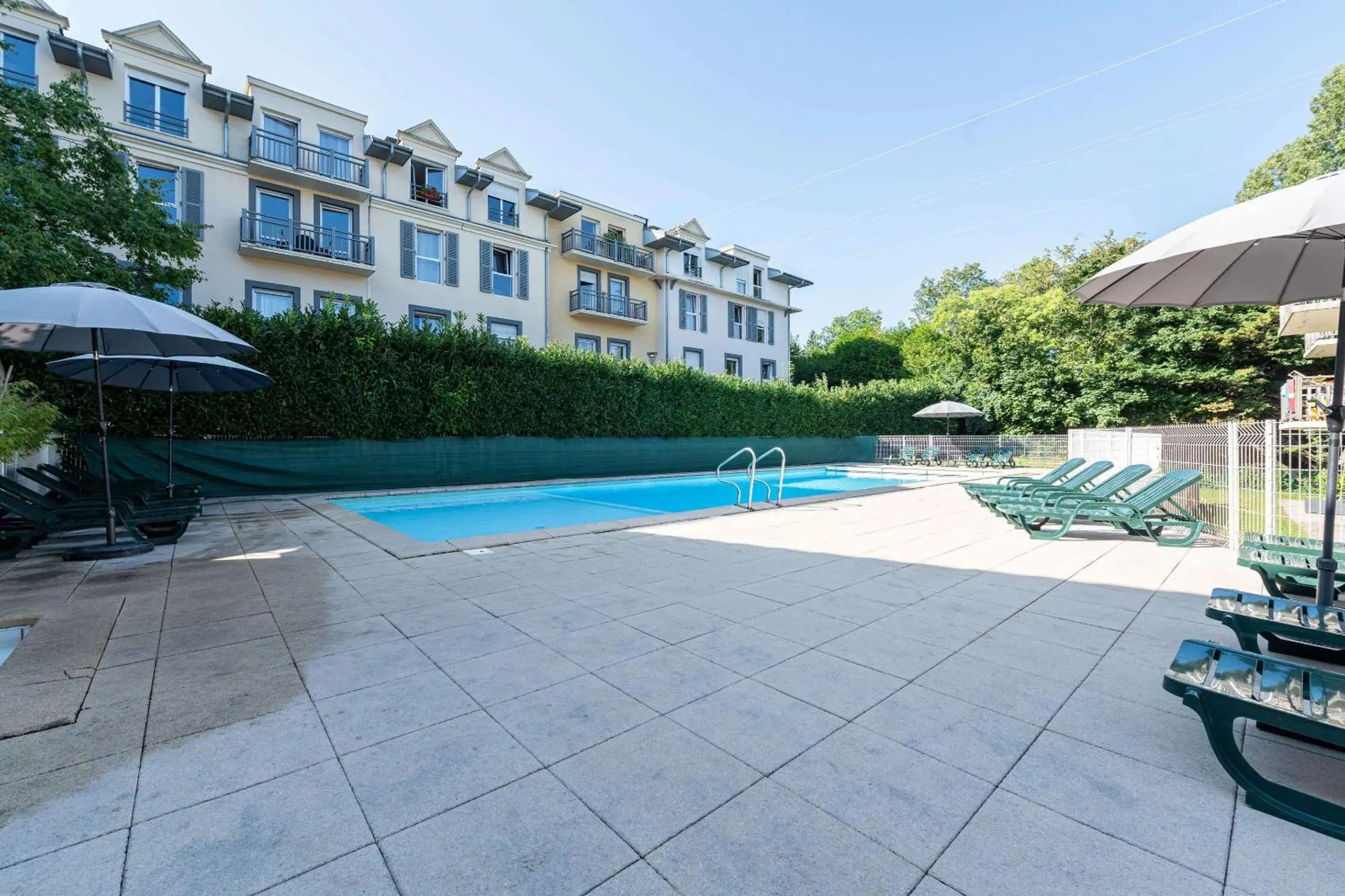 Swimming pool in Zenitude Evian Les Terrasses du Lac, an Ascend Collection Hotel Swimming pool in Zenitude Evian Les Terrasses du Lac, an Ascend Collection Hotel