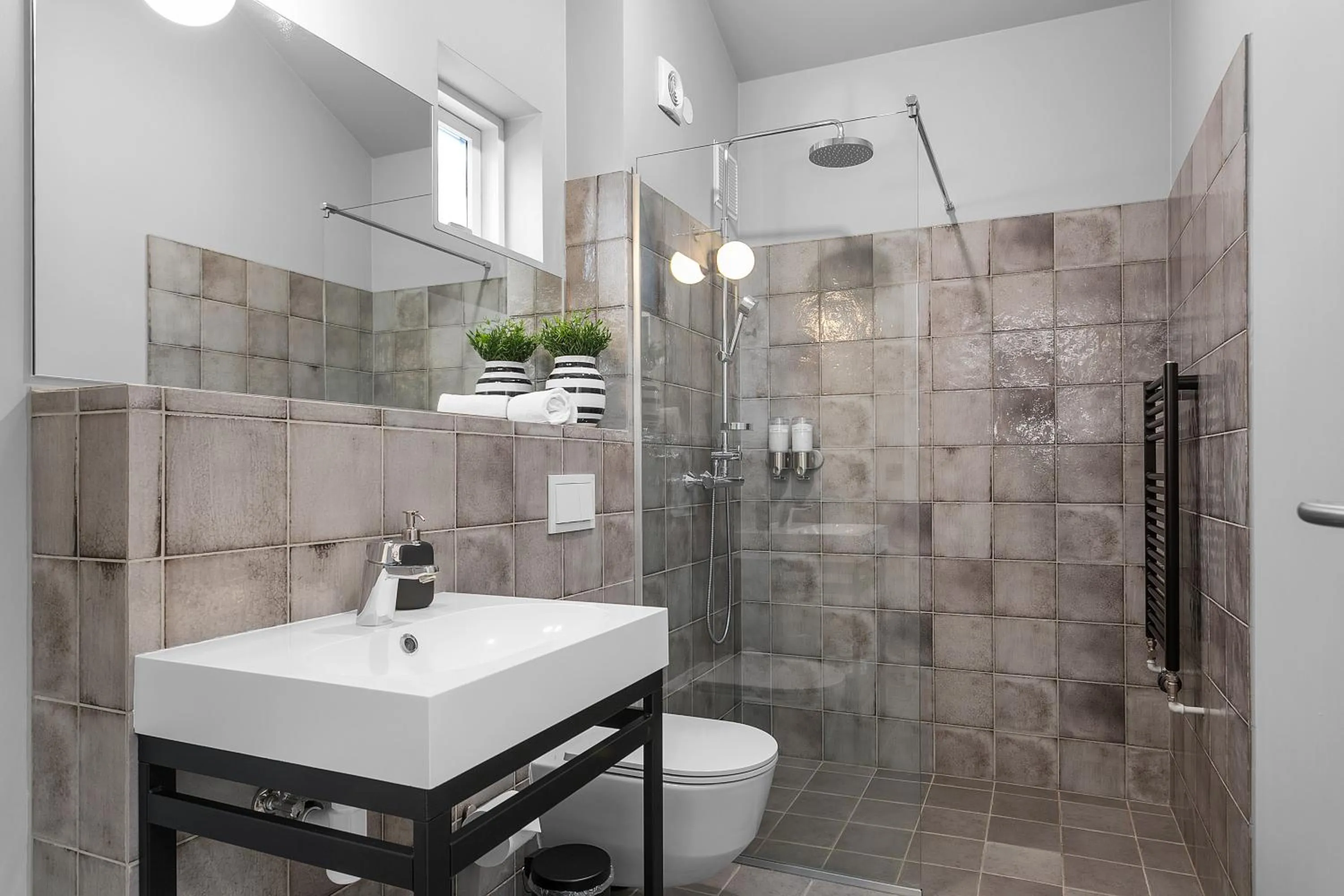 Bathroom in Backyard Apartments by Heimaleiga