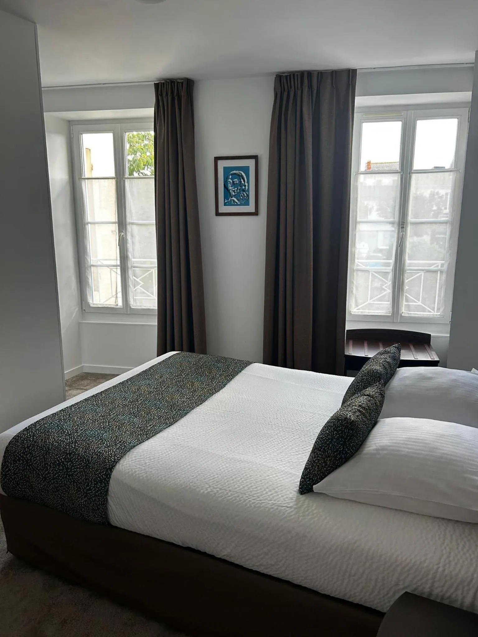 Bed in Logis Hotel Le Richelieu - Royan Atlantique