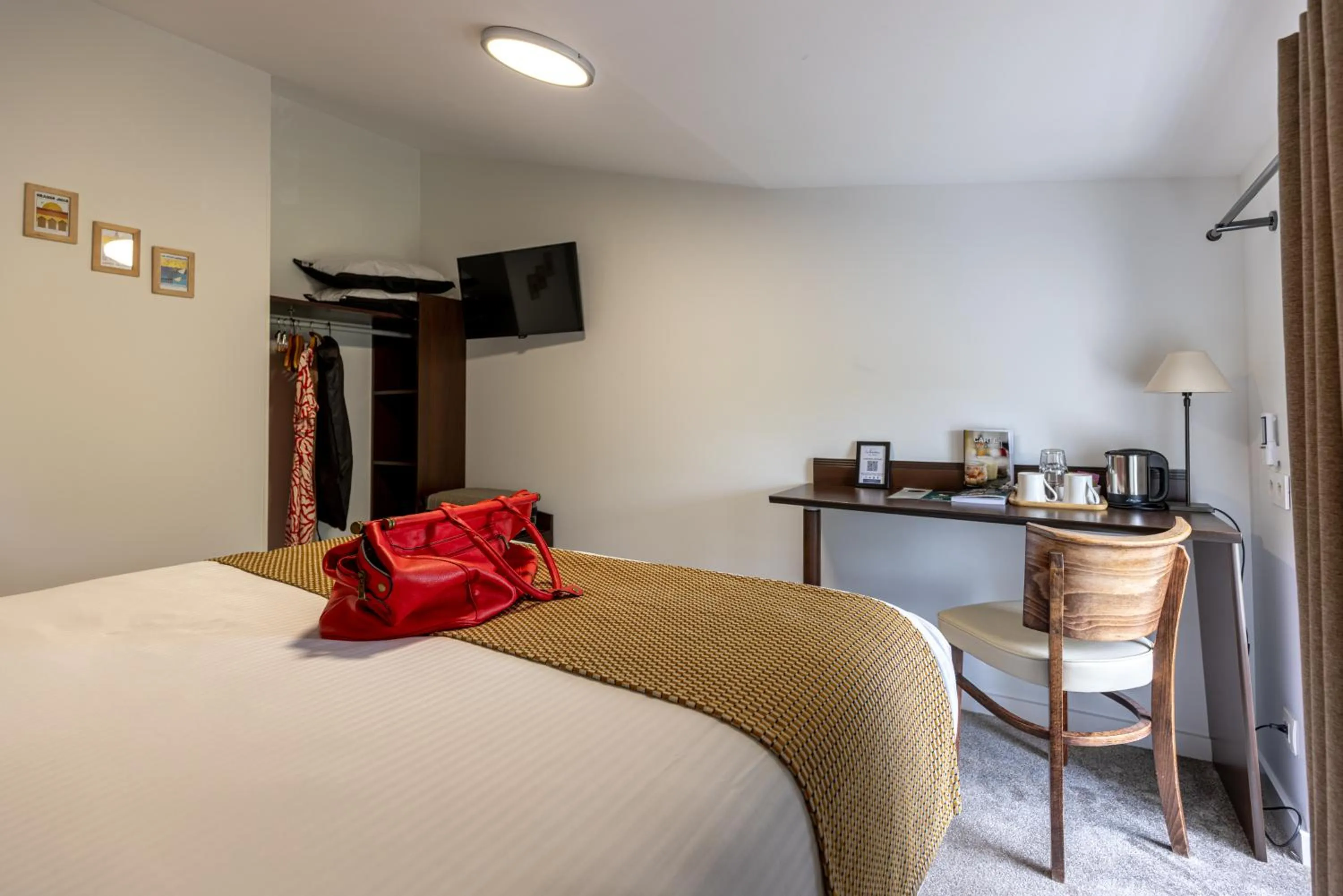 Bed in Logis Hotel Le Richelieu - Royan Atlantique