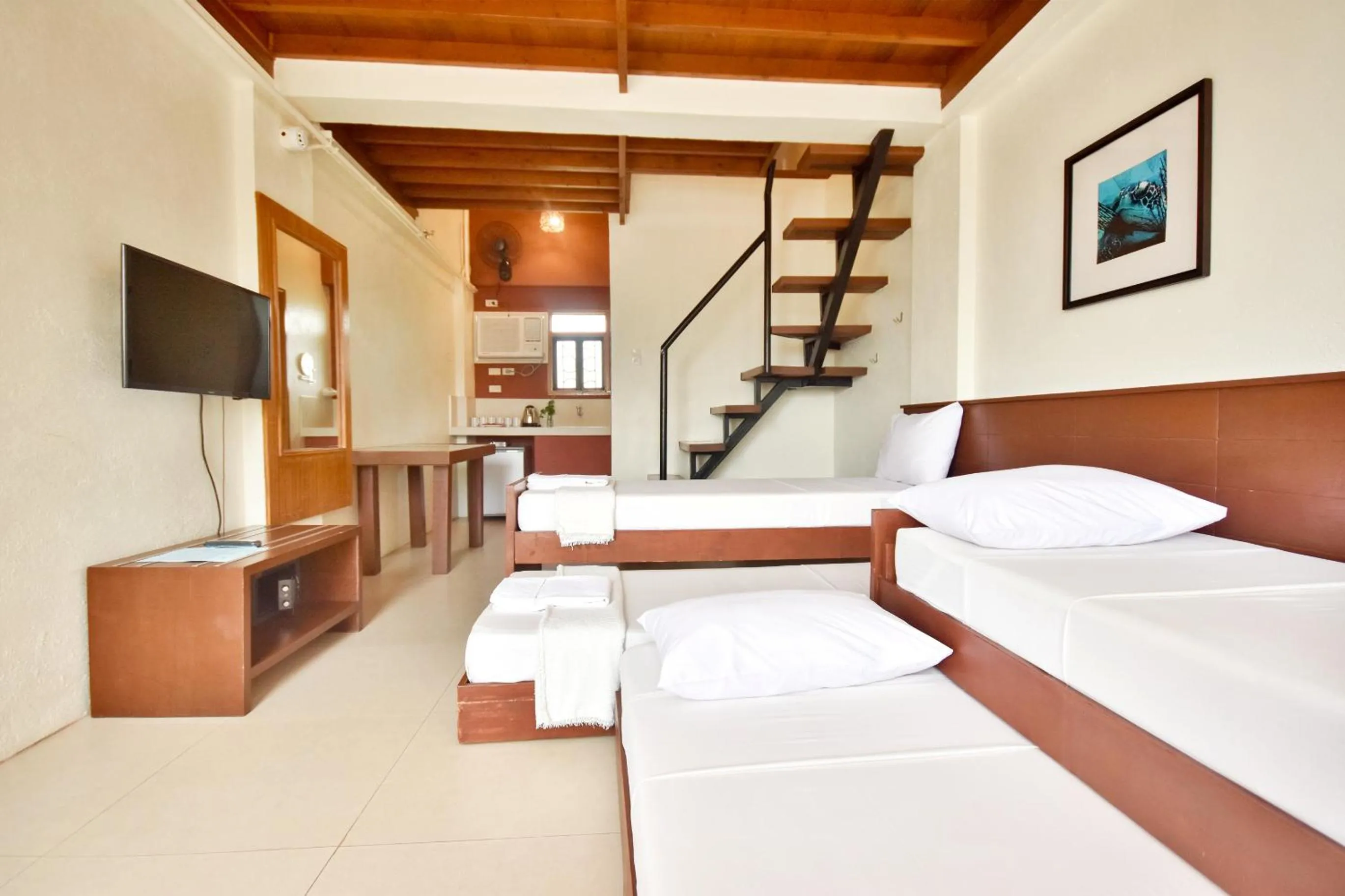 Photo of the whole room, Bed in Agos Boracay Rooms + Beds