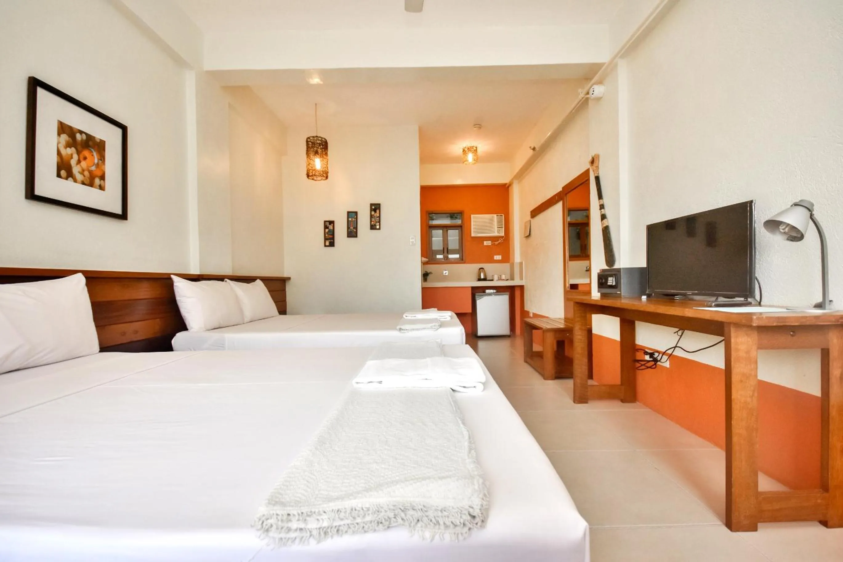 Photo of the whole room, Bed in Agos Boracay Rooms + Beds