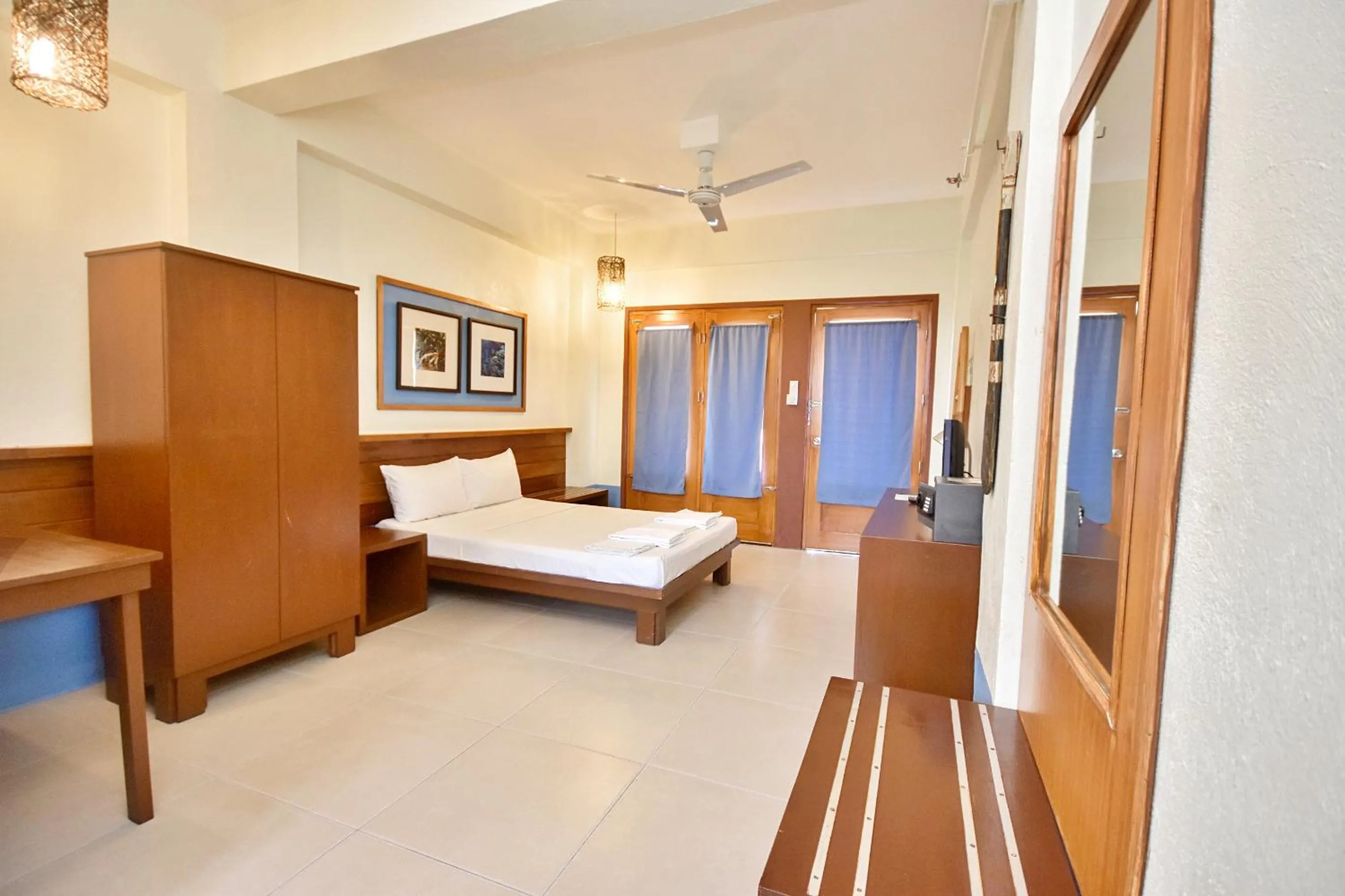 Photo of the whole room, Bed in Agos Boracay Rooms + Beds