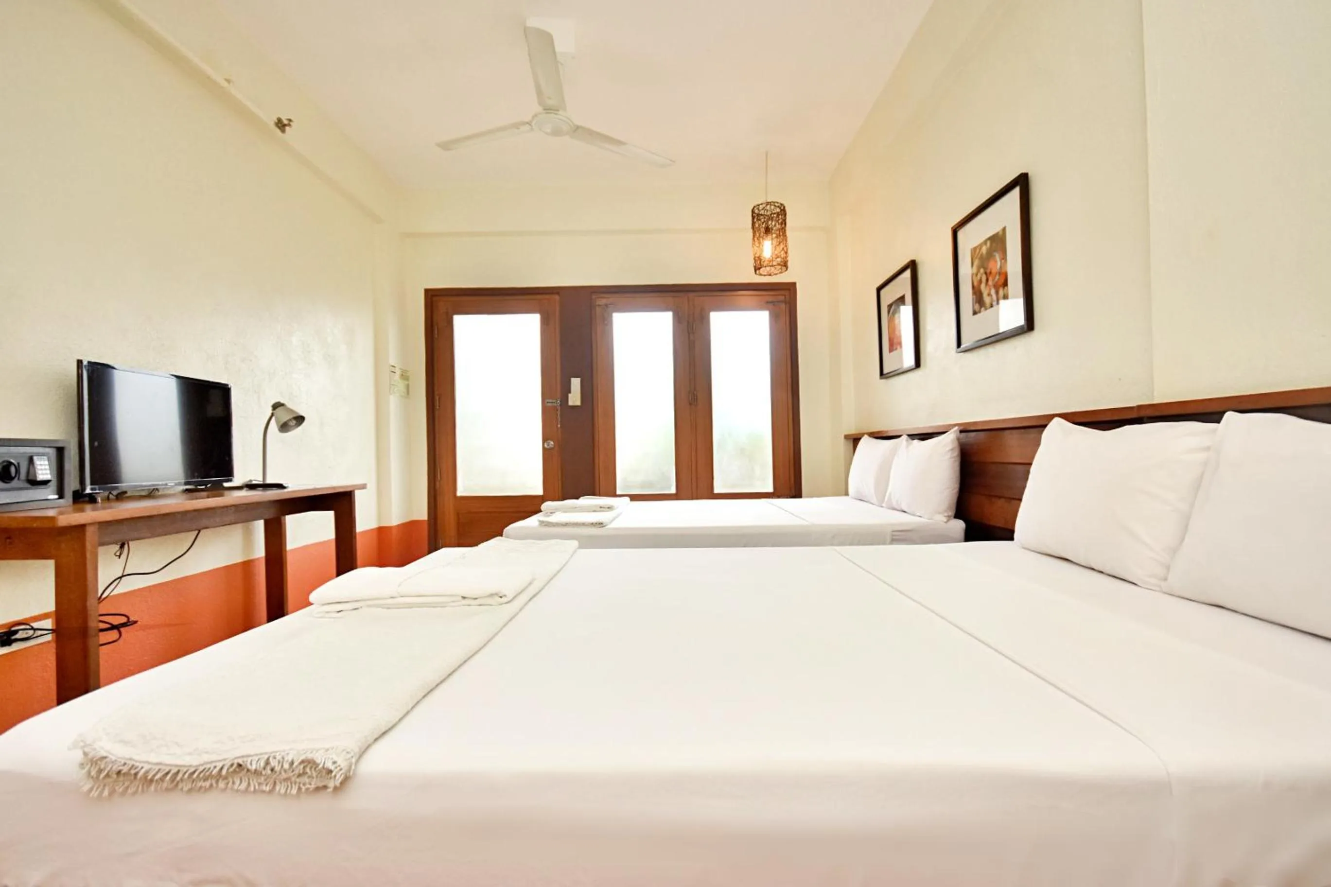 Photo of the whole room, Bed in Agos Boracay Rooms + Beds