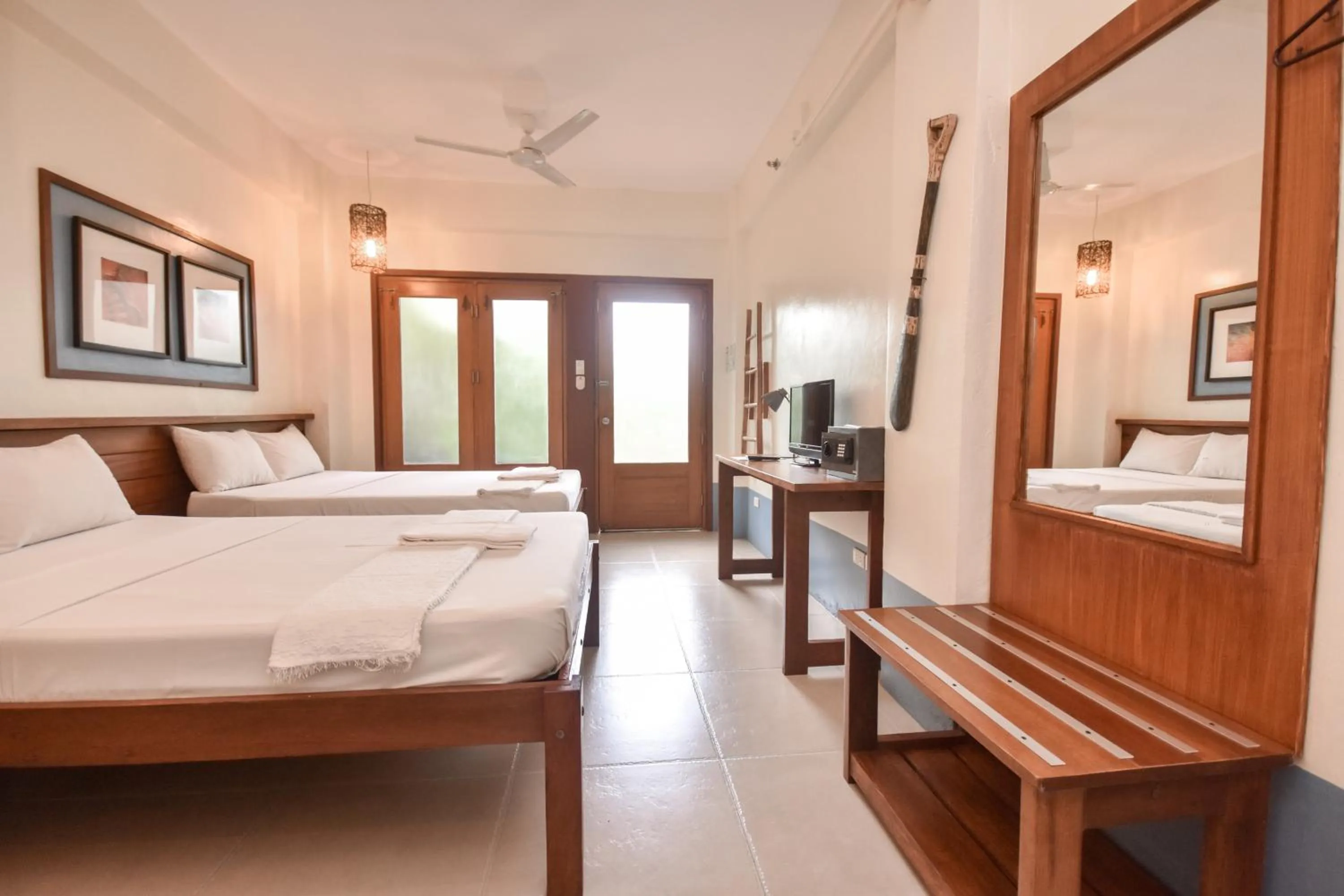 Photo of the whole room, Bed in Agos Boracay Rooms + Beds