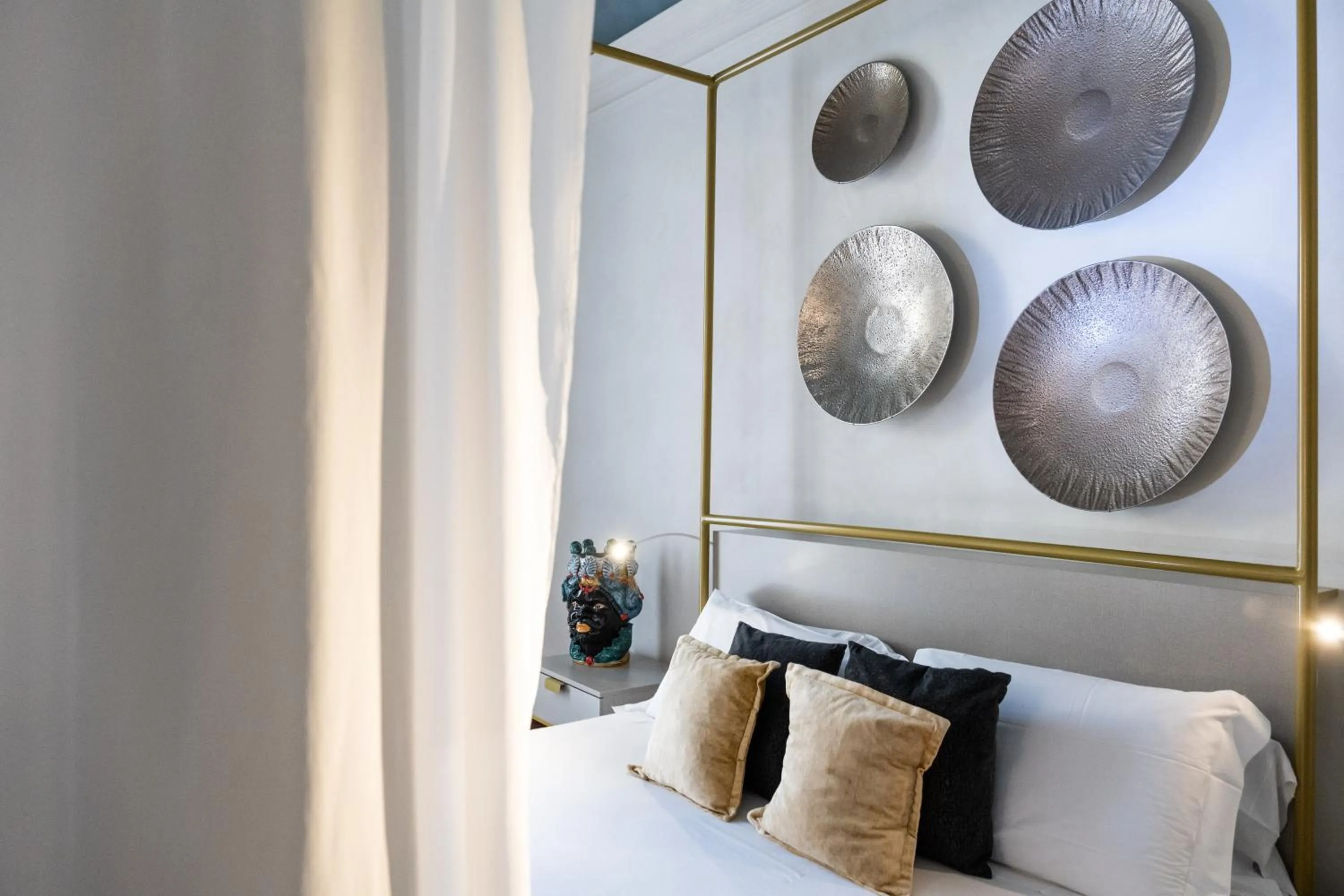 Bed in Scene Suites Apartments