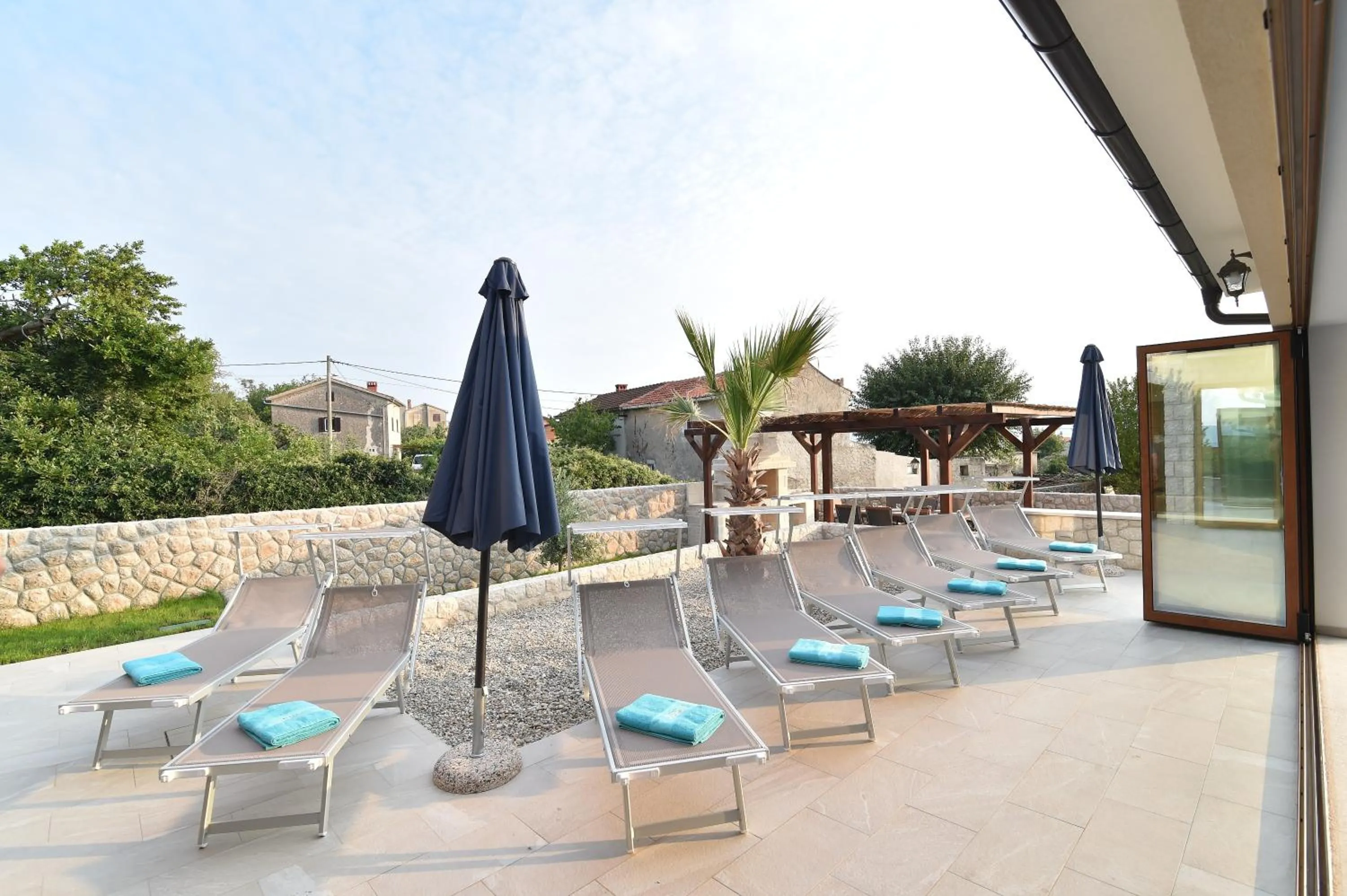 Patio in Villa Muskatel KRK -with heated covered pool