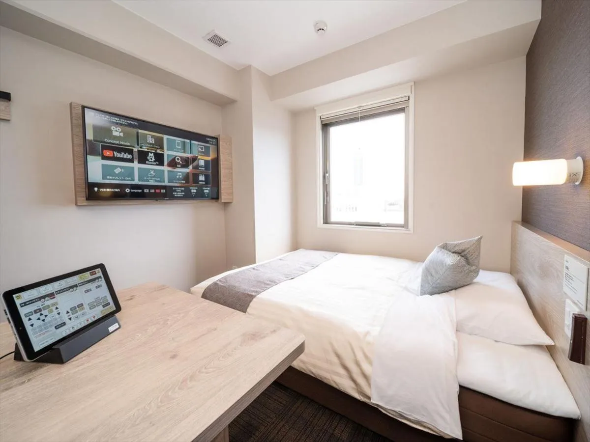 Bed in Super Hotel Premier Saitama Higashiguchi