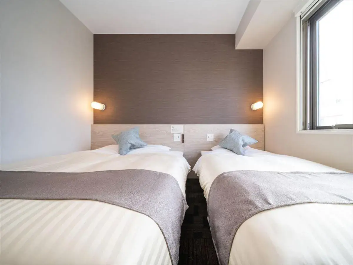 Bed in Super Hotel Premier Saitama Higashiguchi Bed in Super Hotel Premier Saitama Higashiguchi
