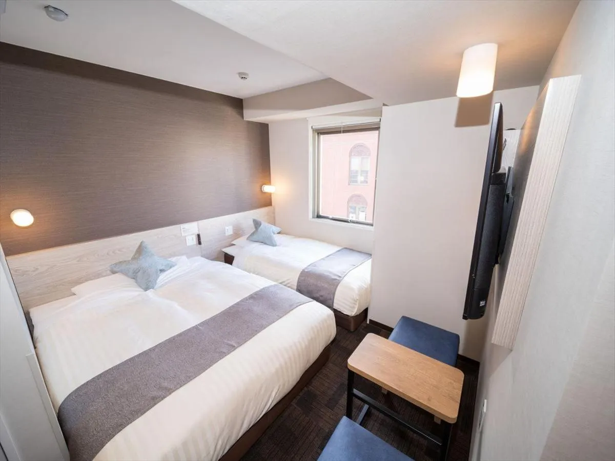 Bed in Super Hotel Premier Saitama Higashiguchi