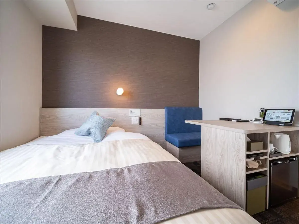 Bed in Super Hotel Premier Saitama Higashiguchi Bed in Super Hotel Premier Saitama Higashiguchi