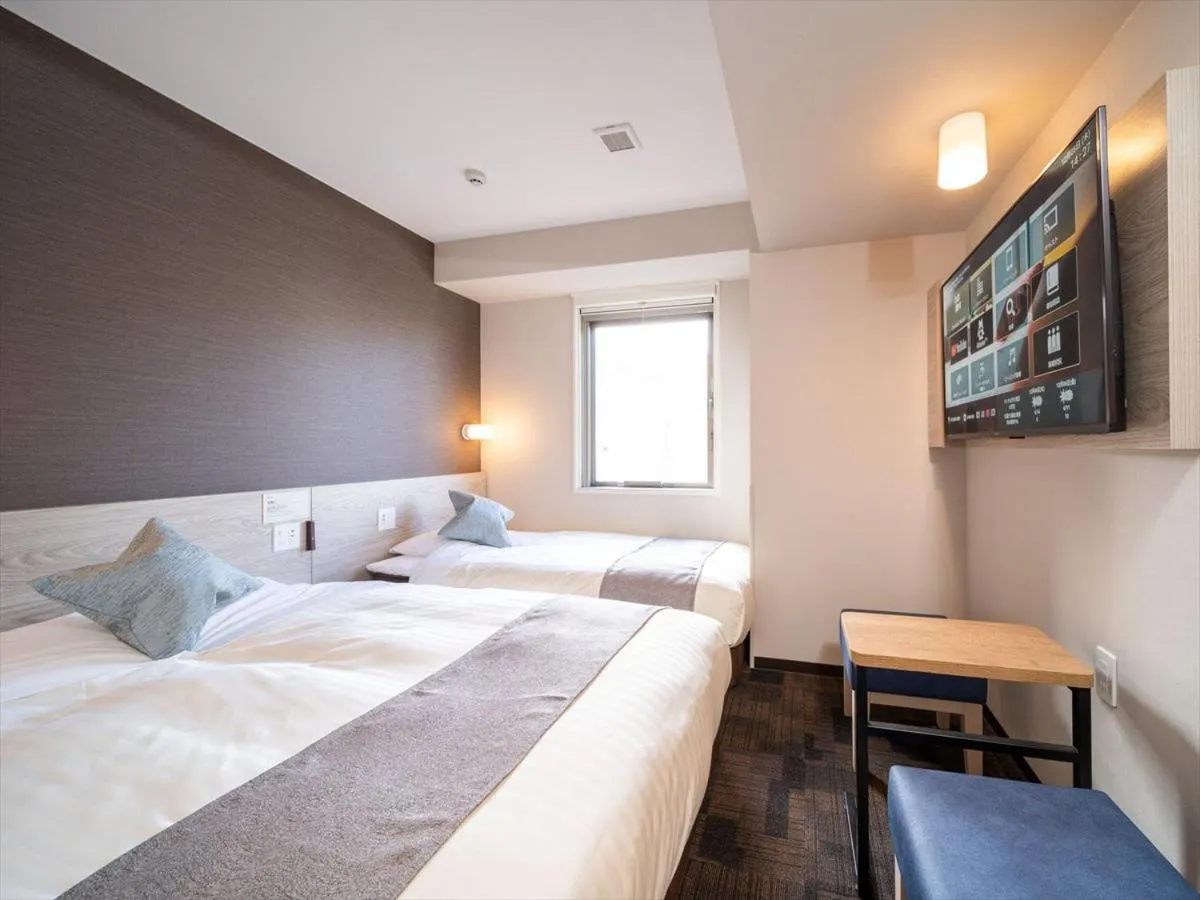 Bed in Super Hotel Premier Saitama Higashiguchi