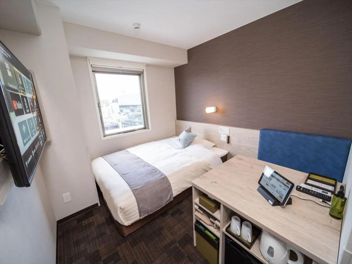 Bed in Super Hotel Premier Saitama Higashiguchi