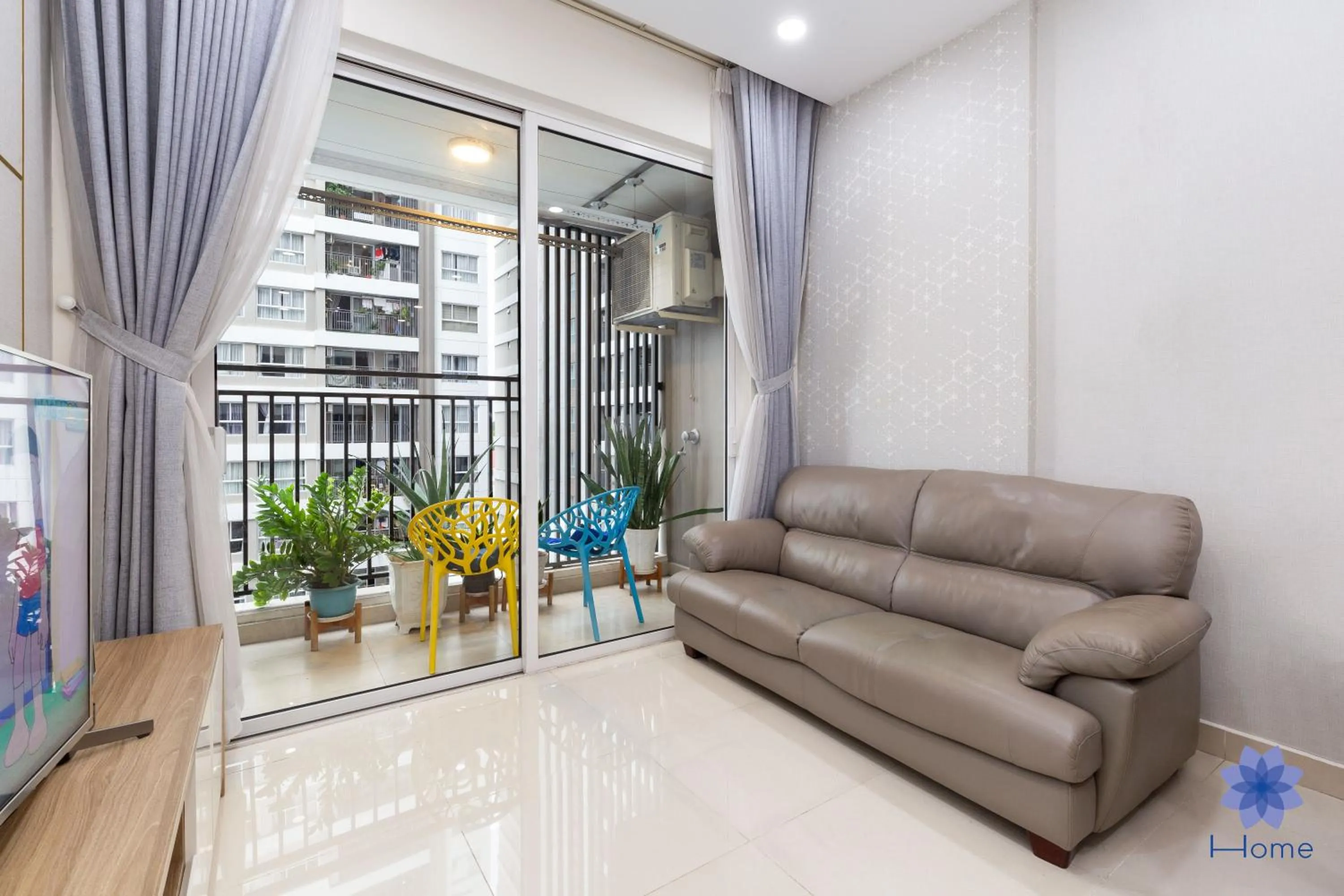 Living room in iHome Furnished Apartments with Free Gym & Pool, Airport Pick-Up Service