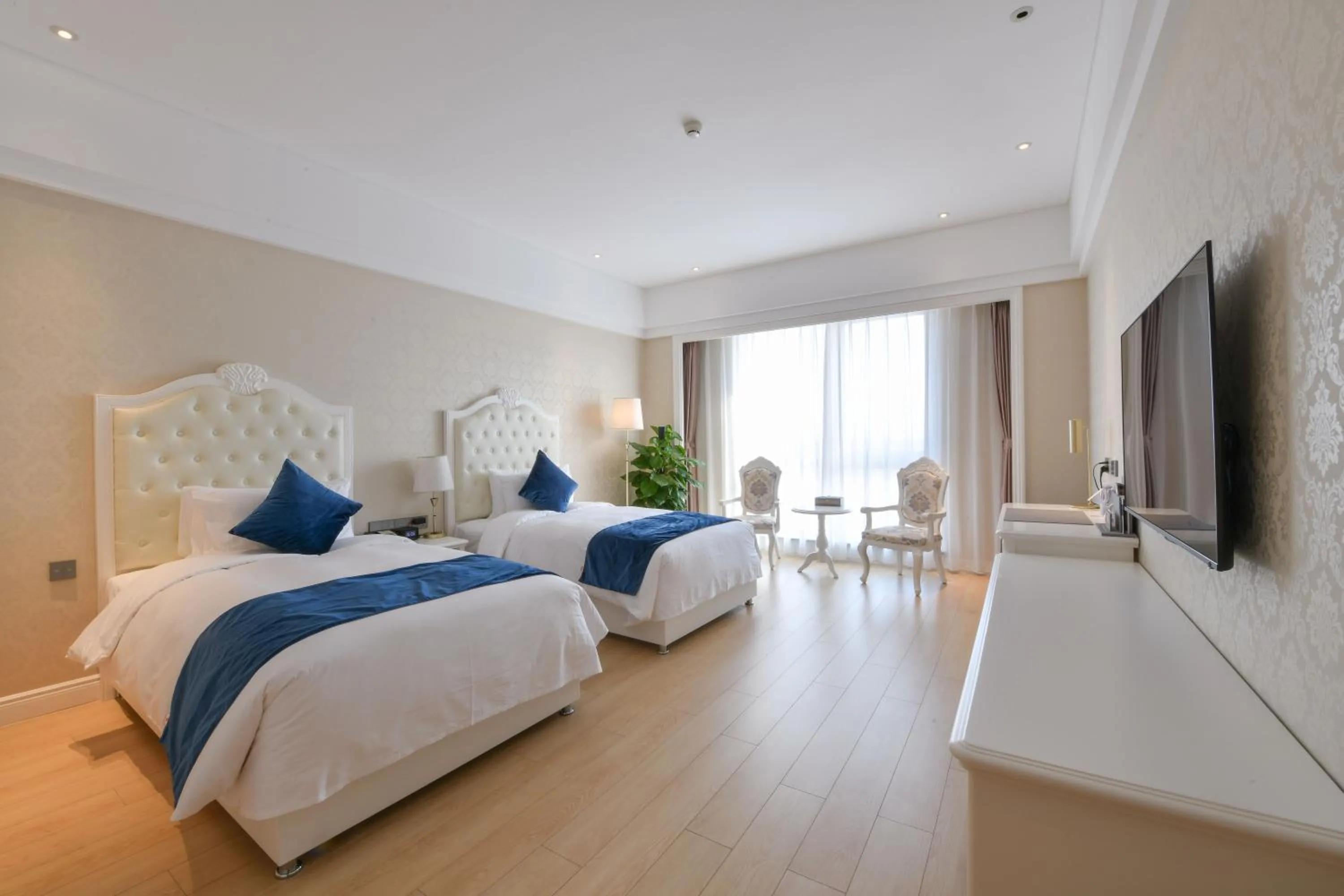 Bedroom, Bed in GUOCE Beijing Capital Airport Hotel & Convention Center