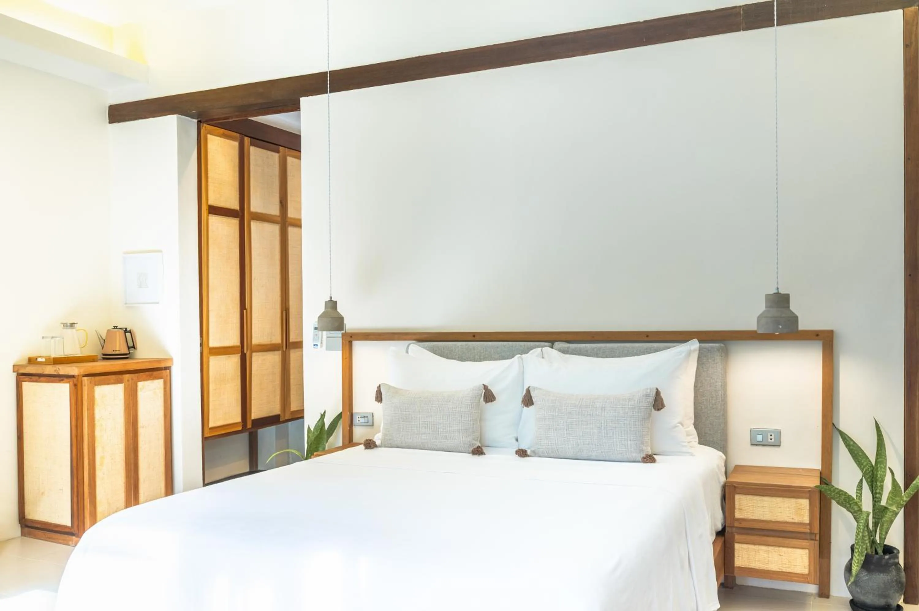Bed in L'Osteria Luxe Beachfront B&B