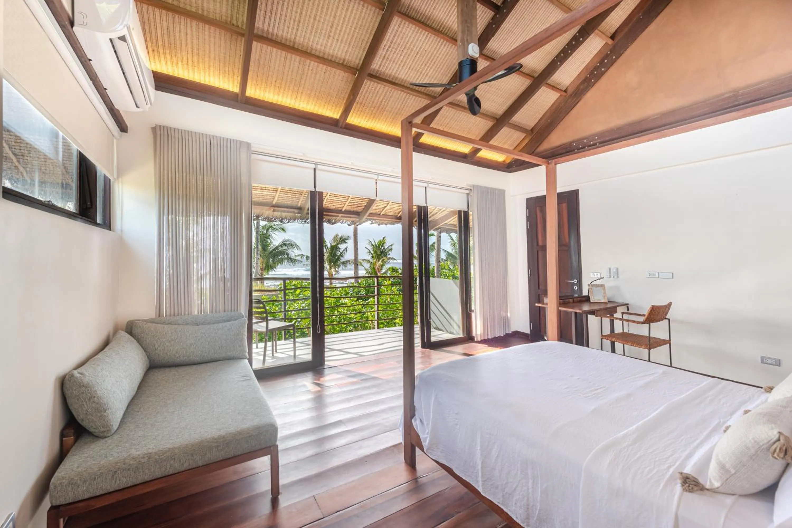 Bed in L'Osteria Luxe Beachfront B&B