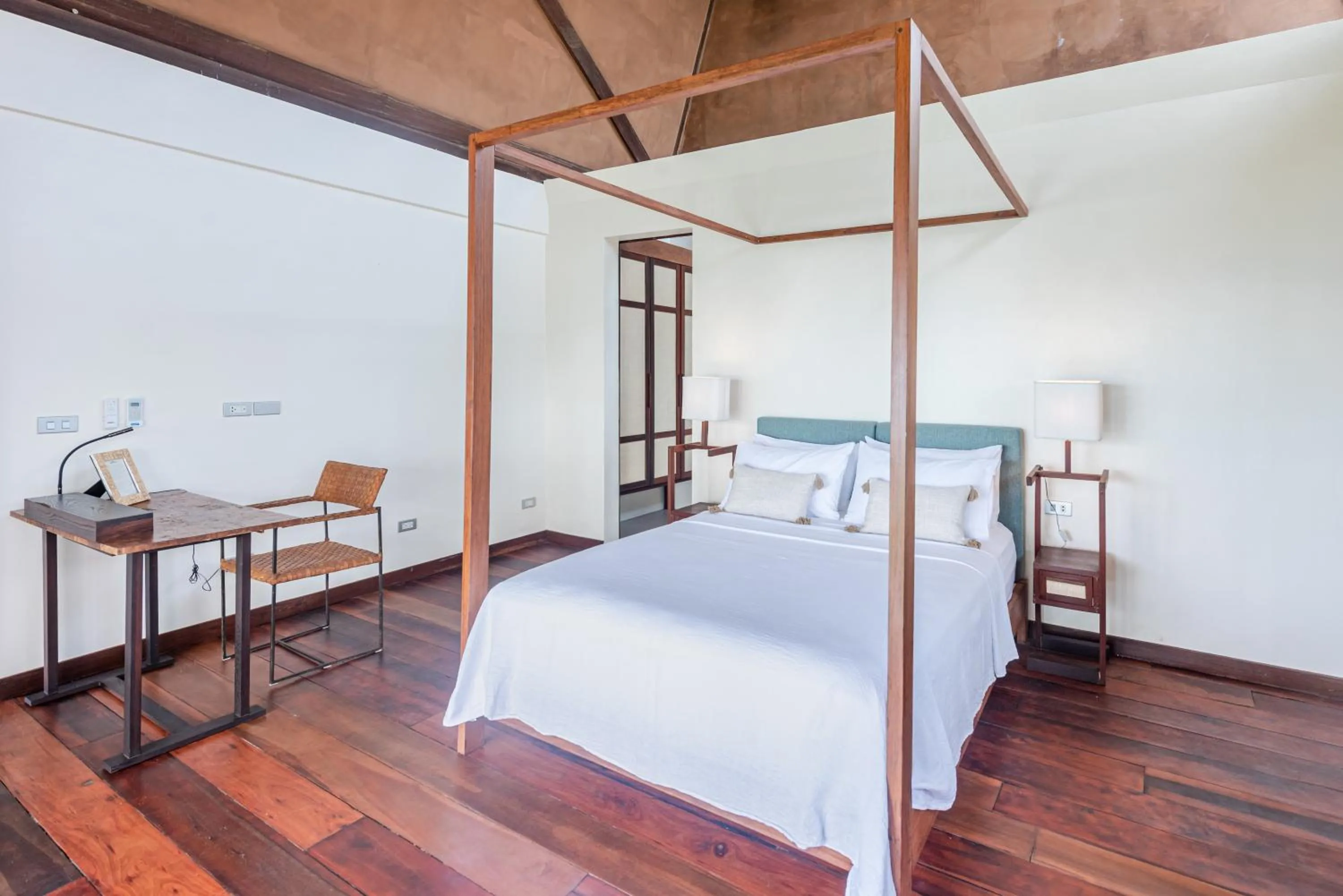 Bed in L'Osteria Luxe Beachfront B&B