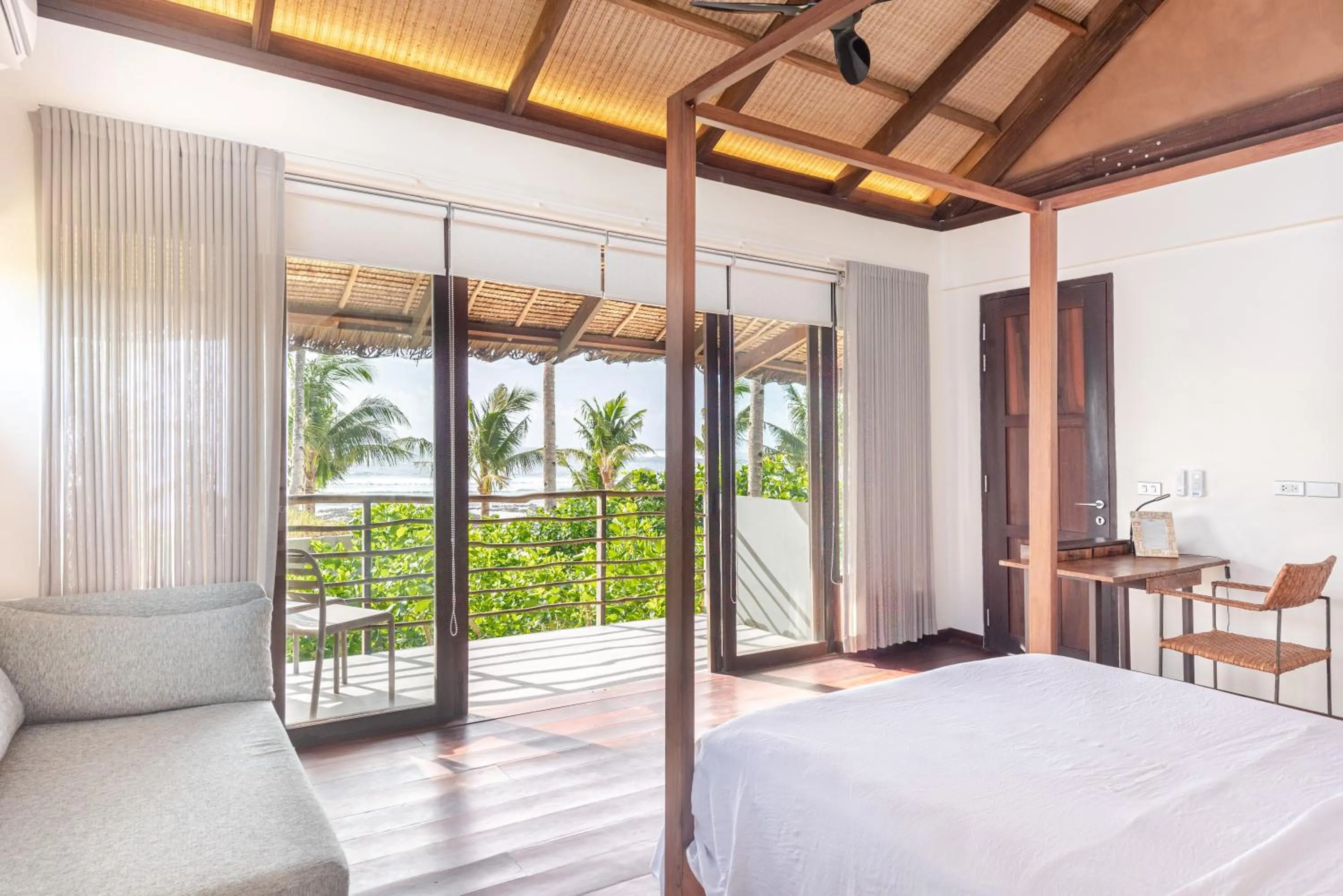 Bed in L'Osteria Luxe Beachfront B&B