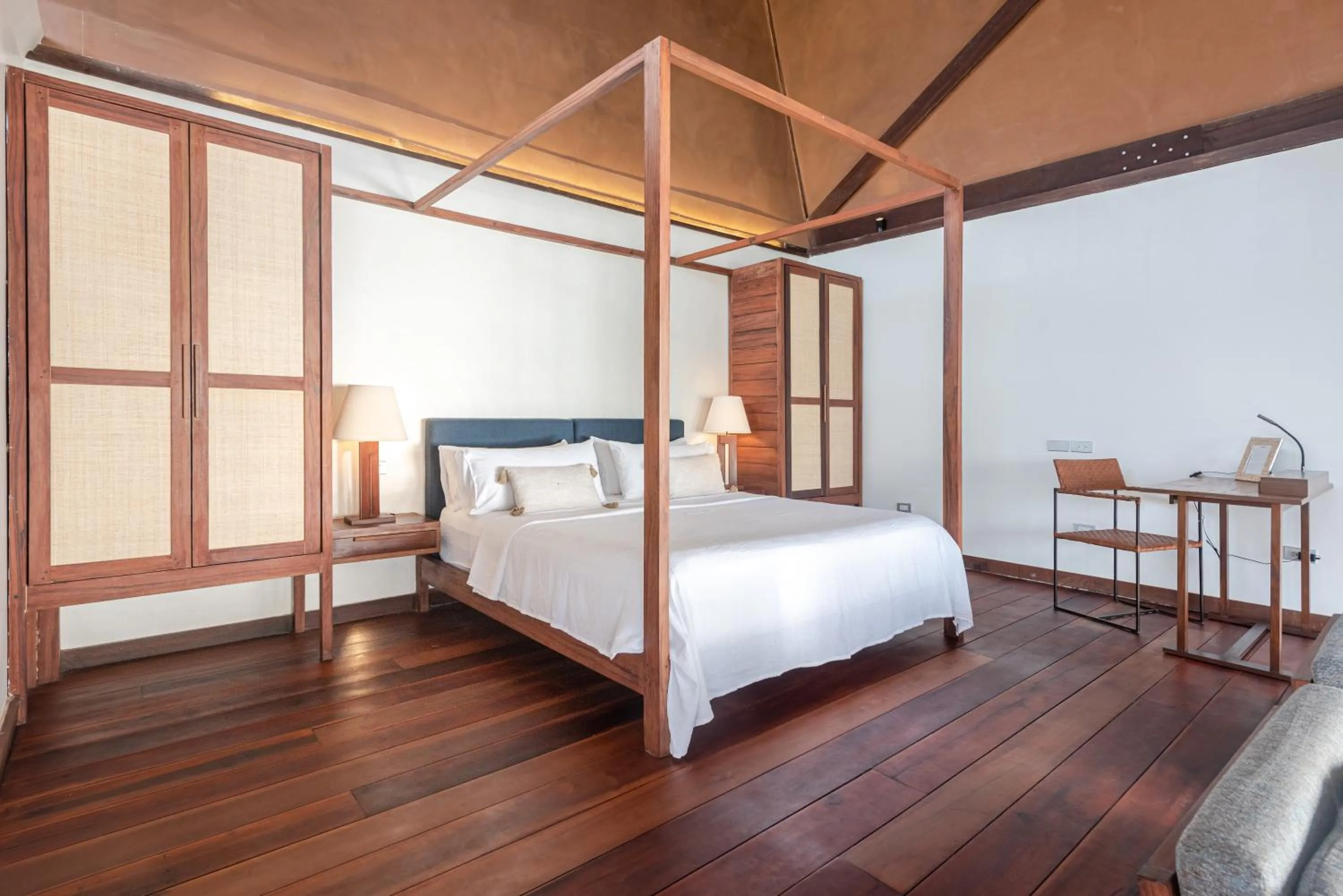 Bed in L'Osteria Luxe Beachfront B&B