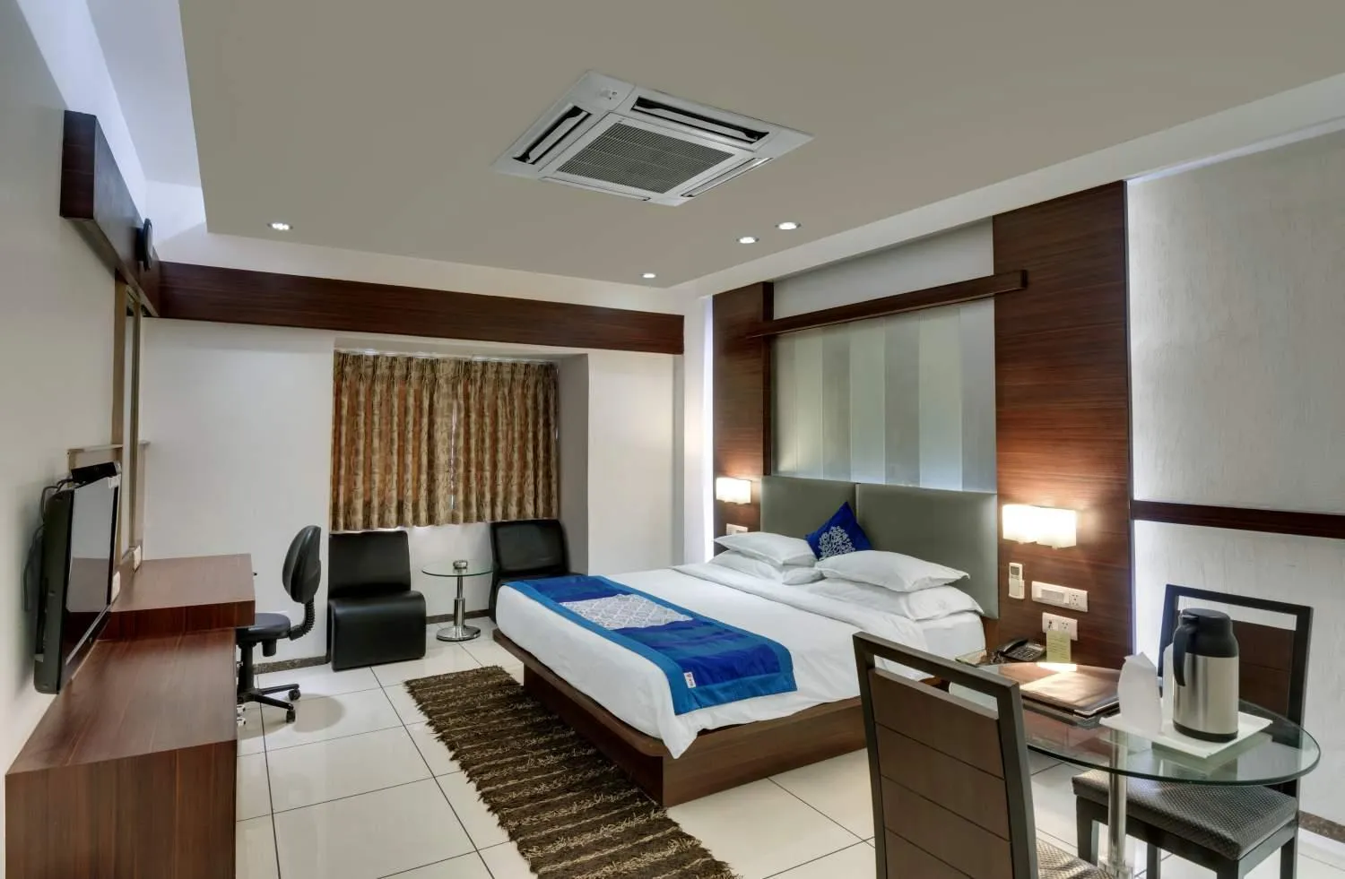 Bed in Pearl Hotel & Banquets Ahmedabad