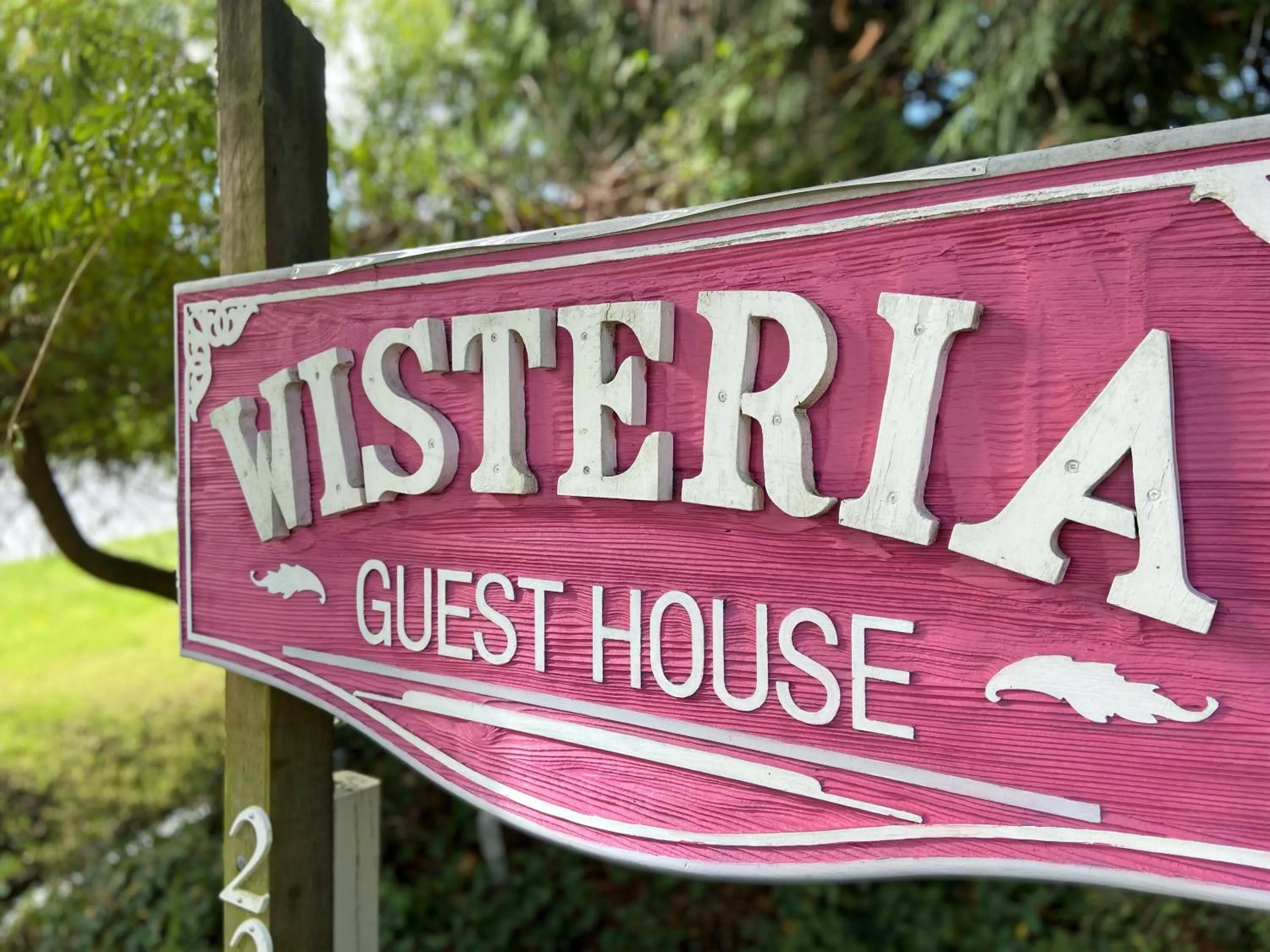Property logo or sign in Wisteria Guest House