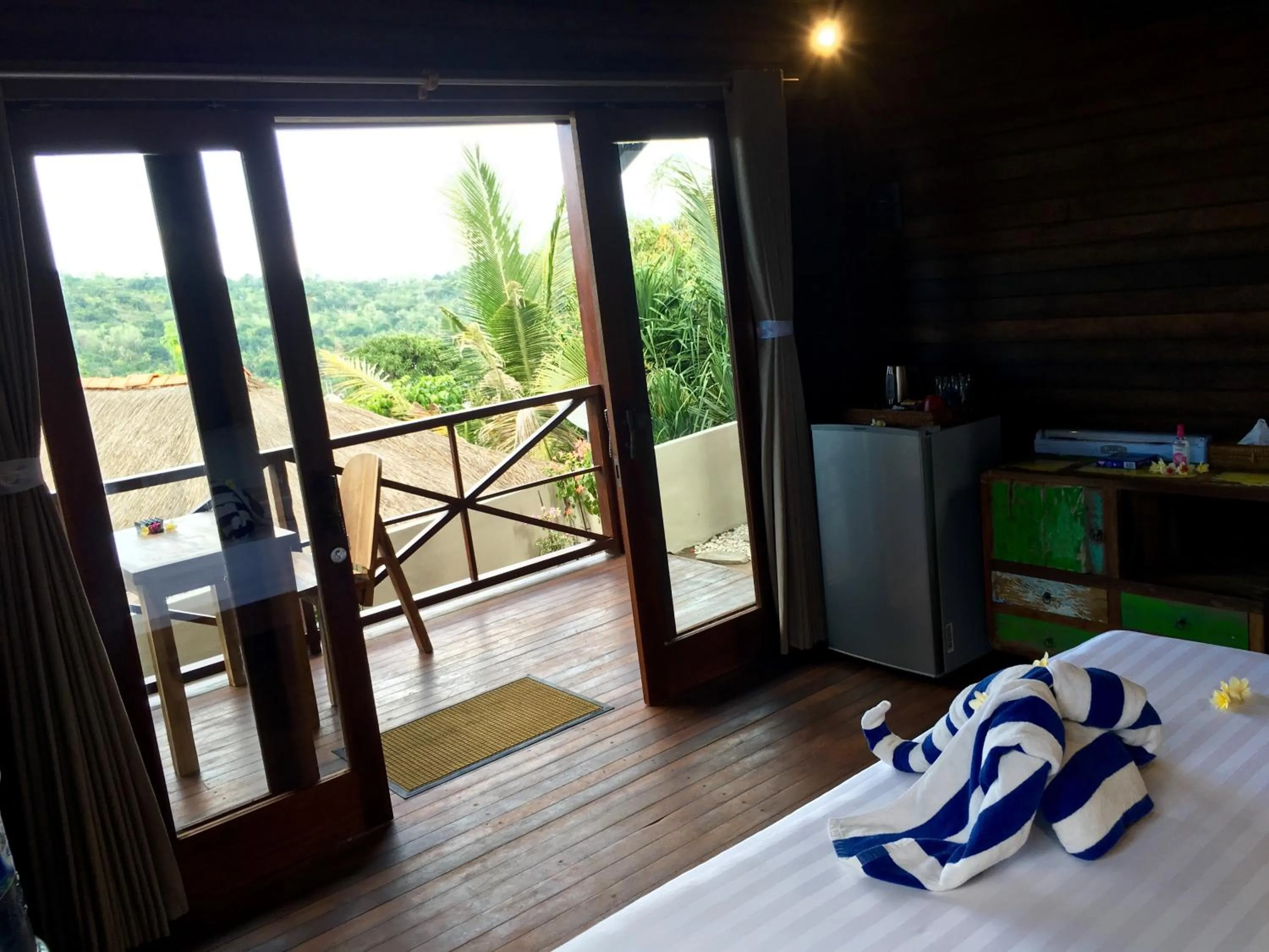 Balcony/Terrace, Bed in Twin Island Villas & Dive Resort