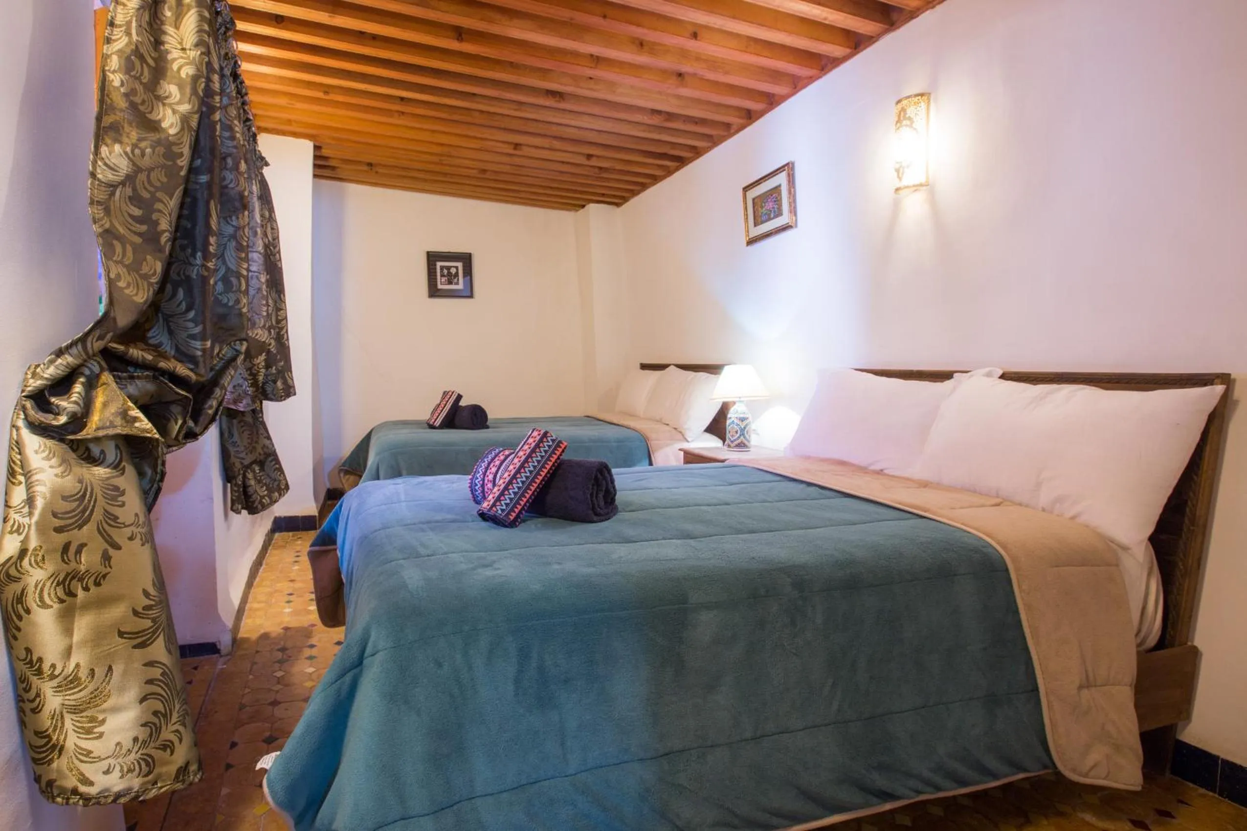 Bed in Riad Zina Fes - Elegance in the Heart of Fes