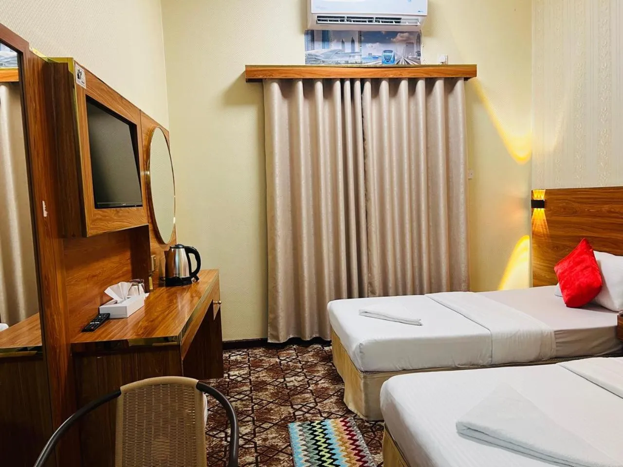 Bed in Parasol Hotel