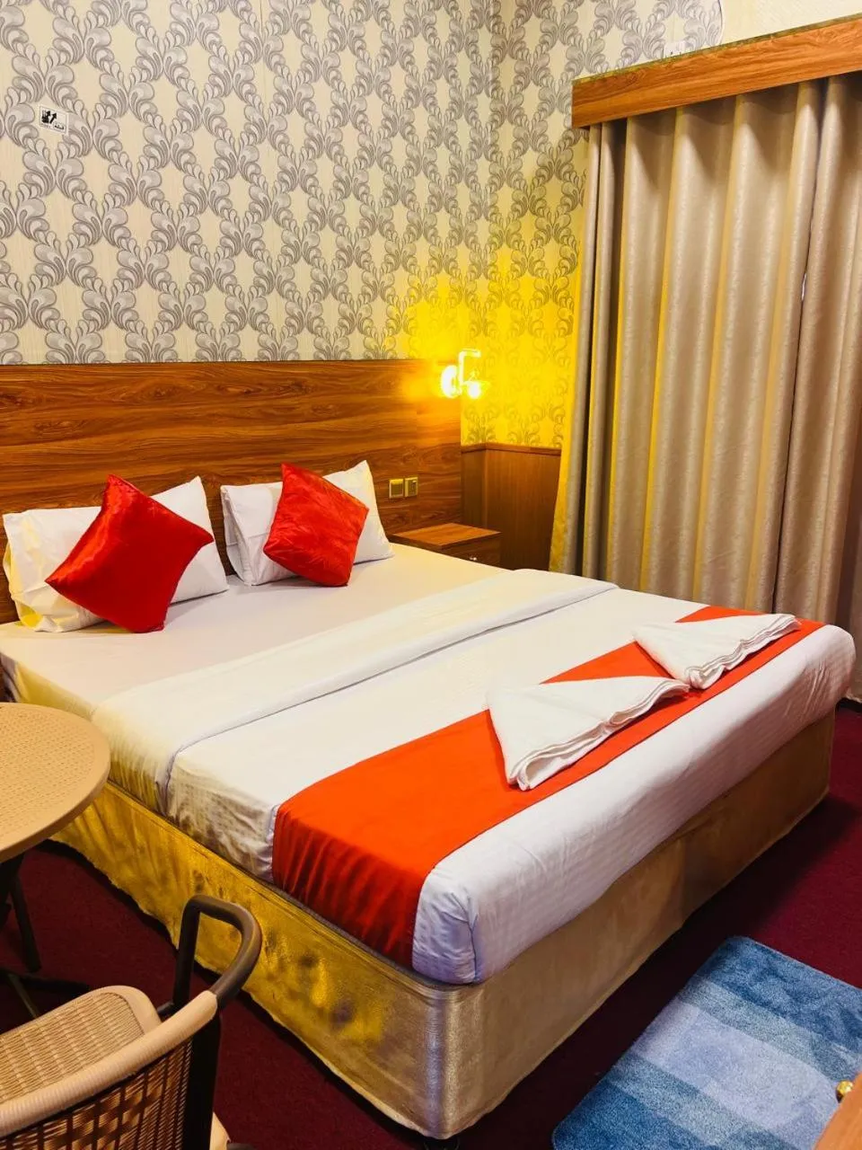 Bed in Parasol Hotel